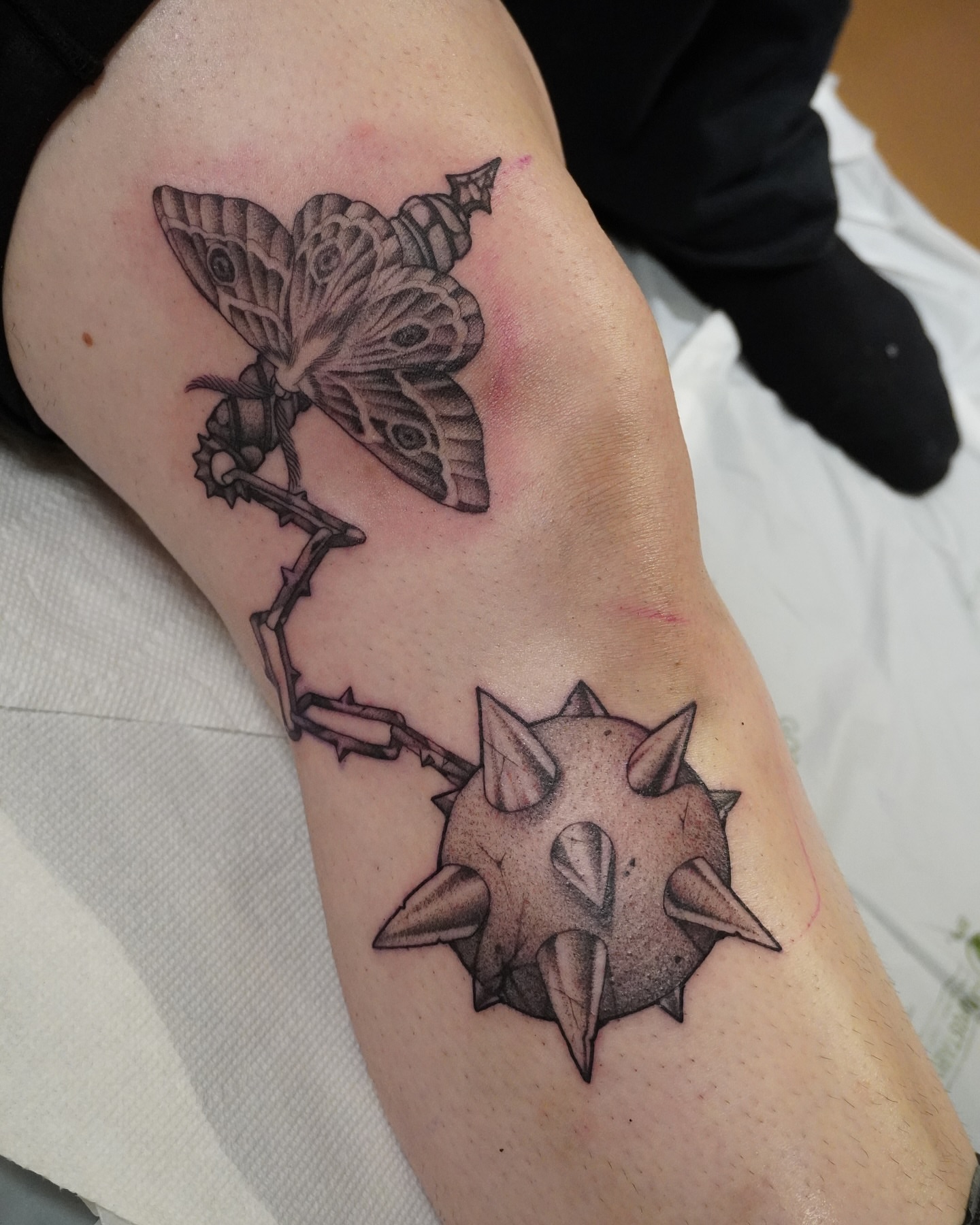 Butterfly and spiked orb geometric tattoo on the forearm by abigail 🌸