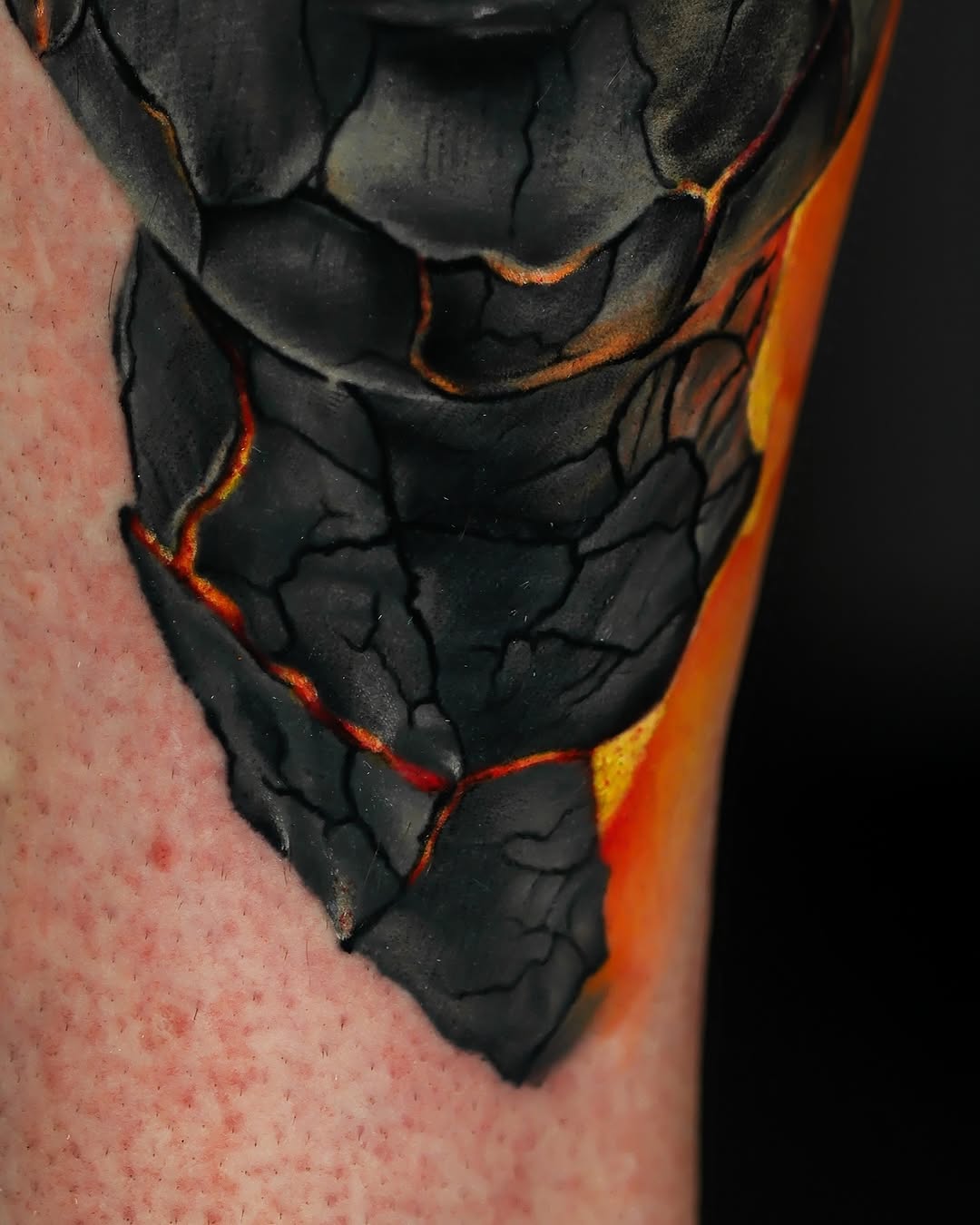 Cracked earth with lava surrealism tattoo on the forearm by Felipe Andrade