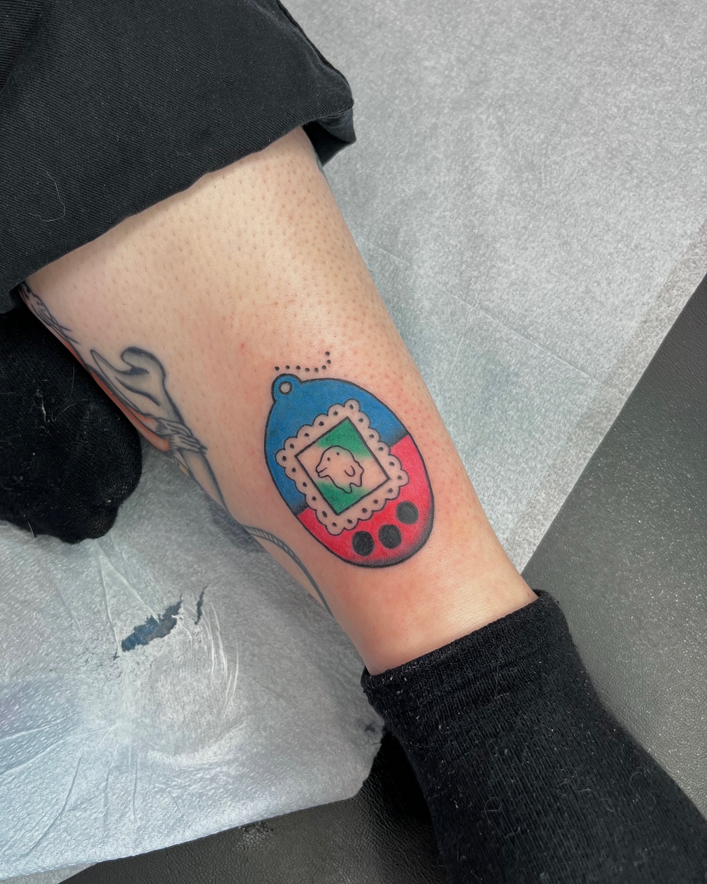 Ladybug dotwork tattoo on the forearm by Taylor Newton