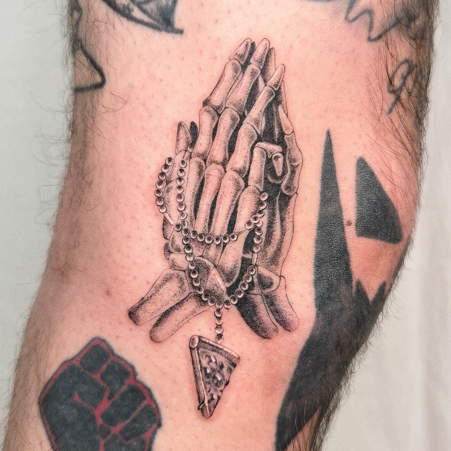 Praying hands realism tattoo on the forearm by Jenni Palomaa