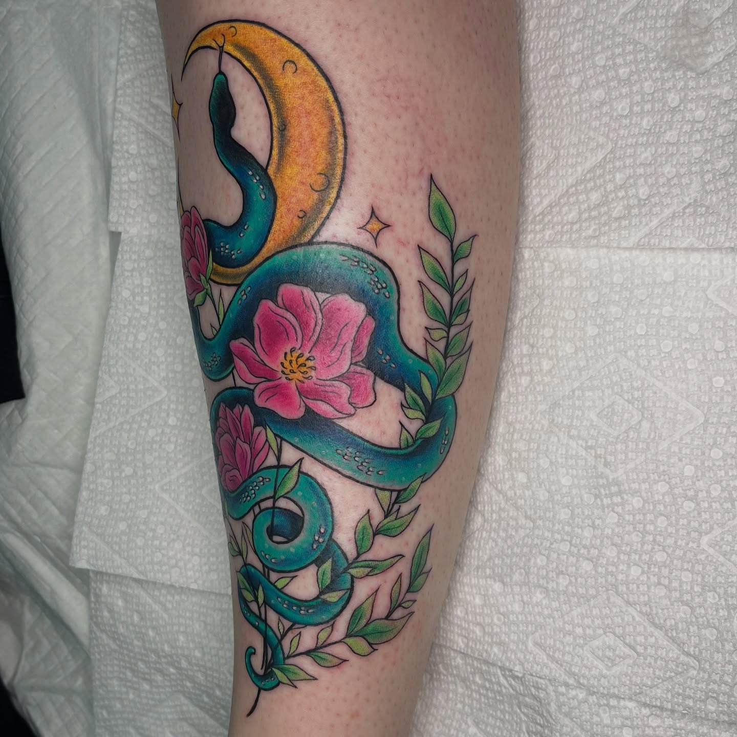 Snake and flowers new school tattoo on the forearm by Krystal ✨