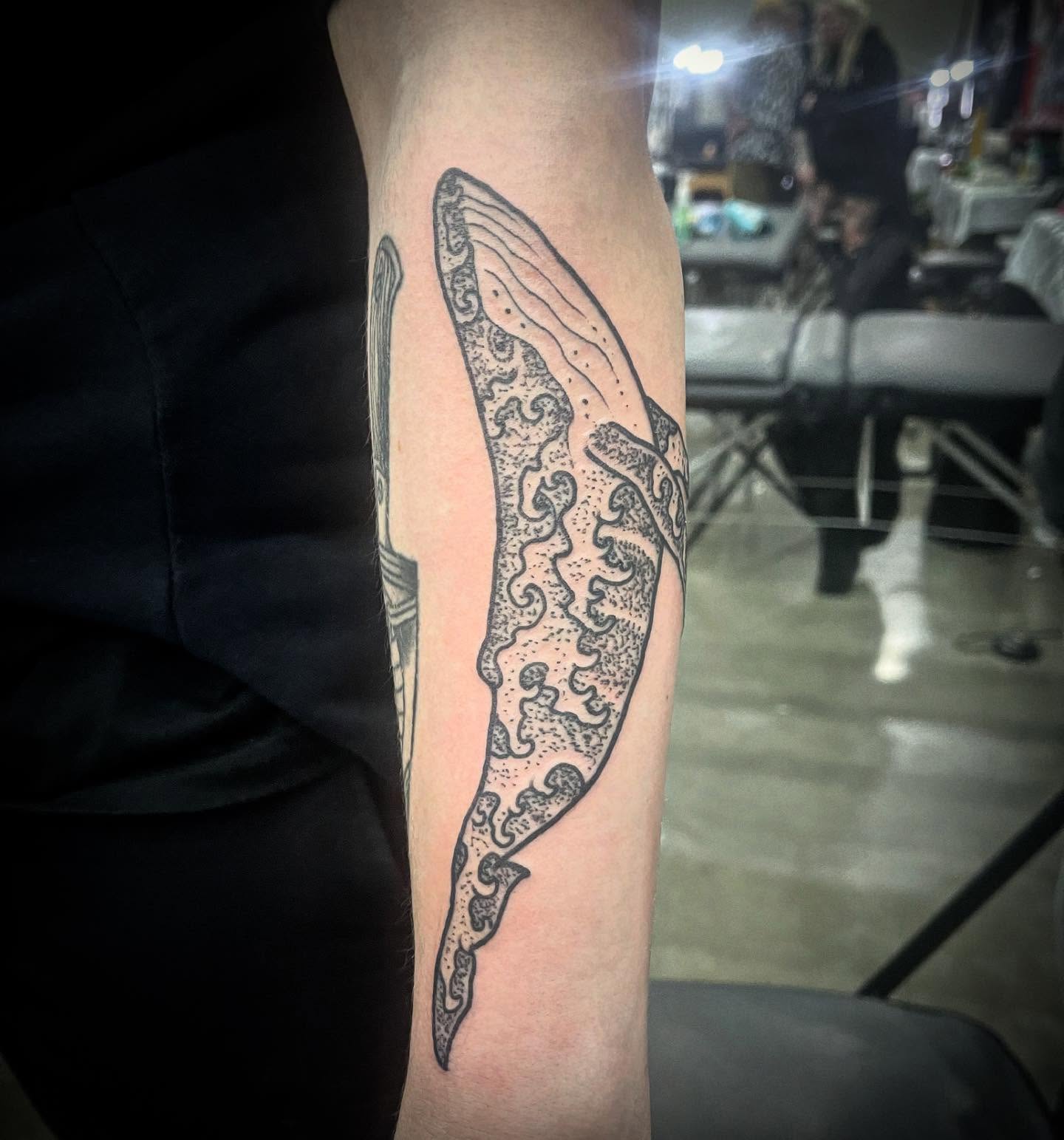 Whale tail dotwork tattoo on the forearm by Don Juan