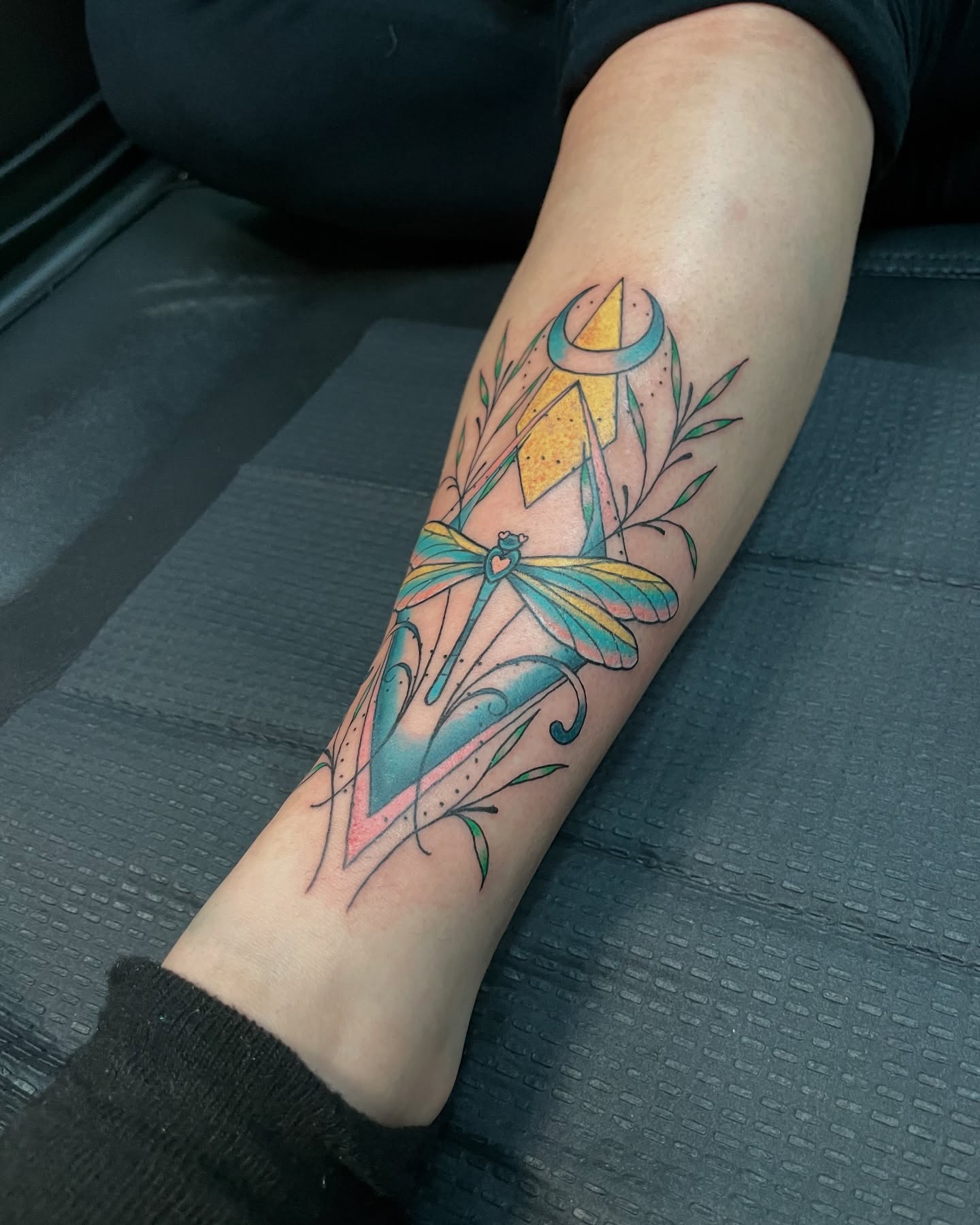 Dragonfly new school tattoo on the forearm by Candence Smith