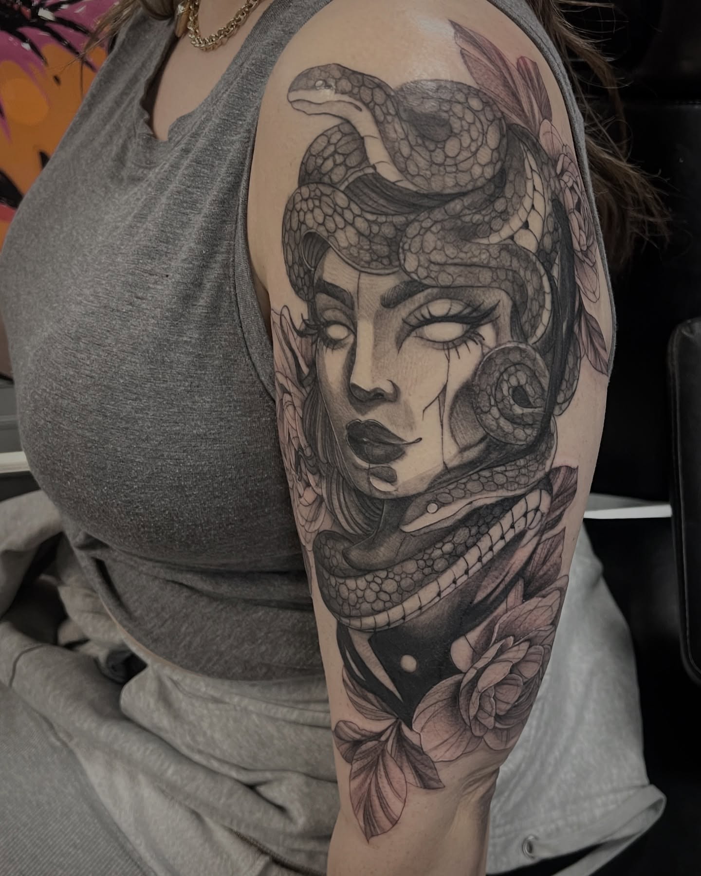 Woman with snakes realism tattoo on the shoulder by Kat