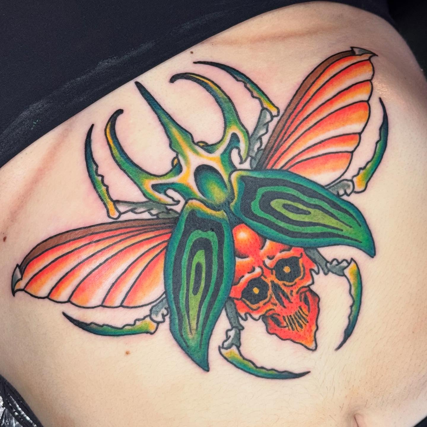 Butterfly skull American traditional tattoo on the thigh by David Gottschalk