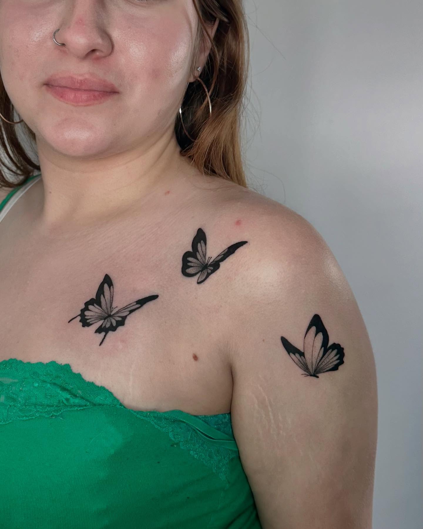 Butterflies black and grey tattoo on the shoulder by Felipe Pacifico