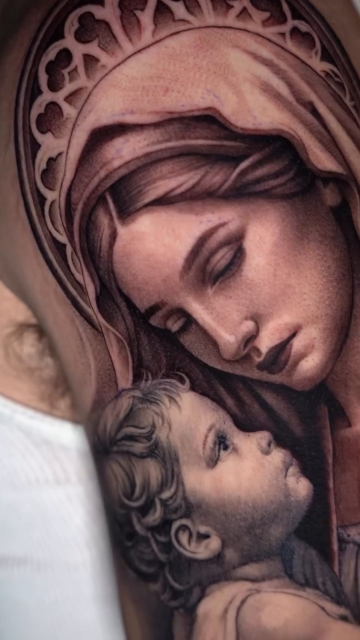 Virgin Mary and child realism tattoo by Risa