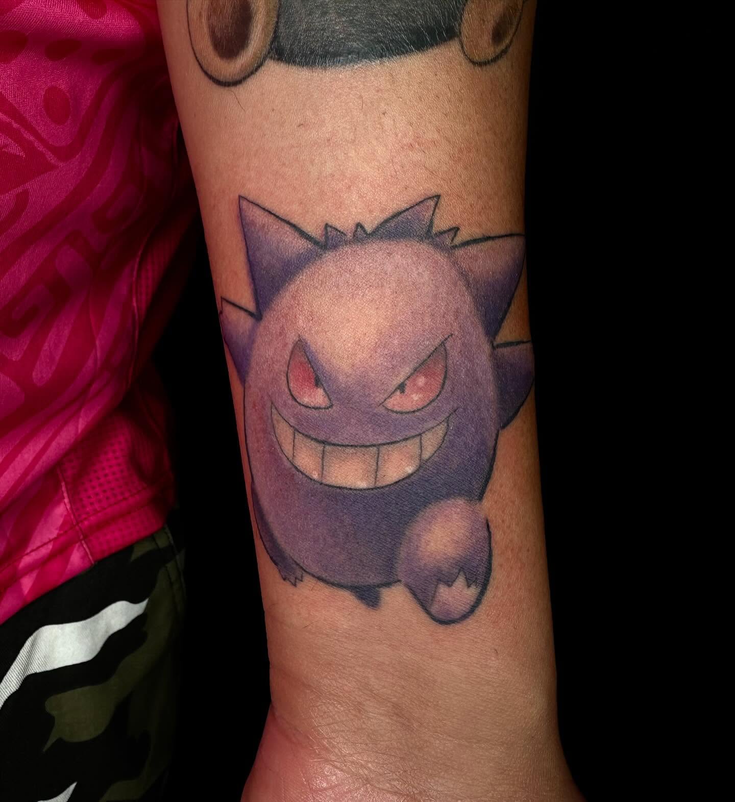 Gengar realism tattoo on the forearm by Jay Morales