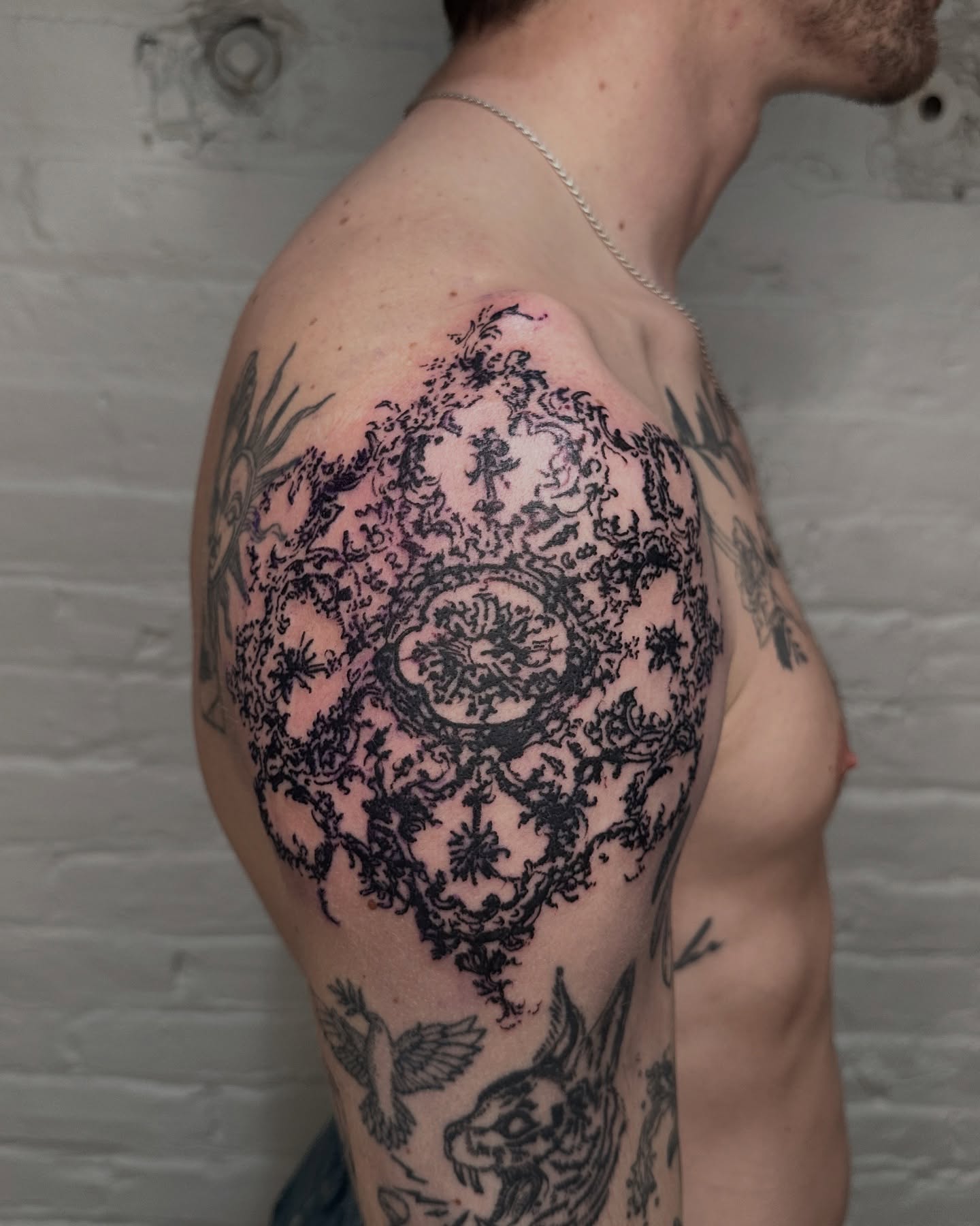 Medallion black and grey tattoo on the shoulder by πΈππππππ