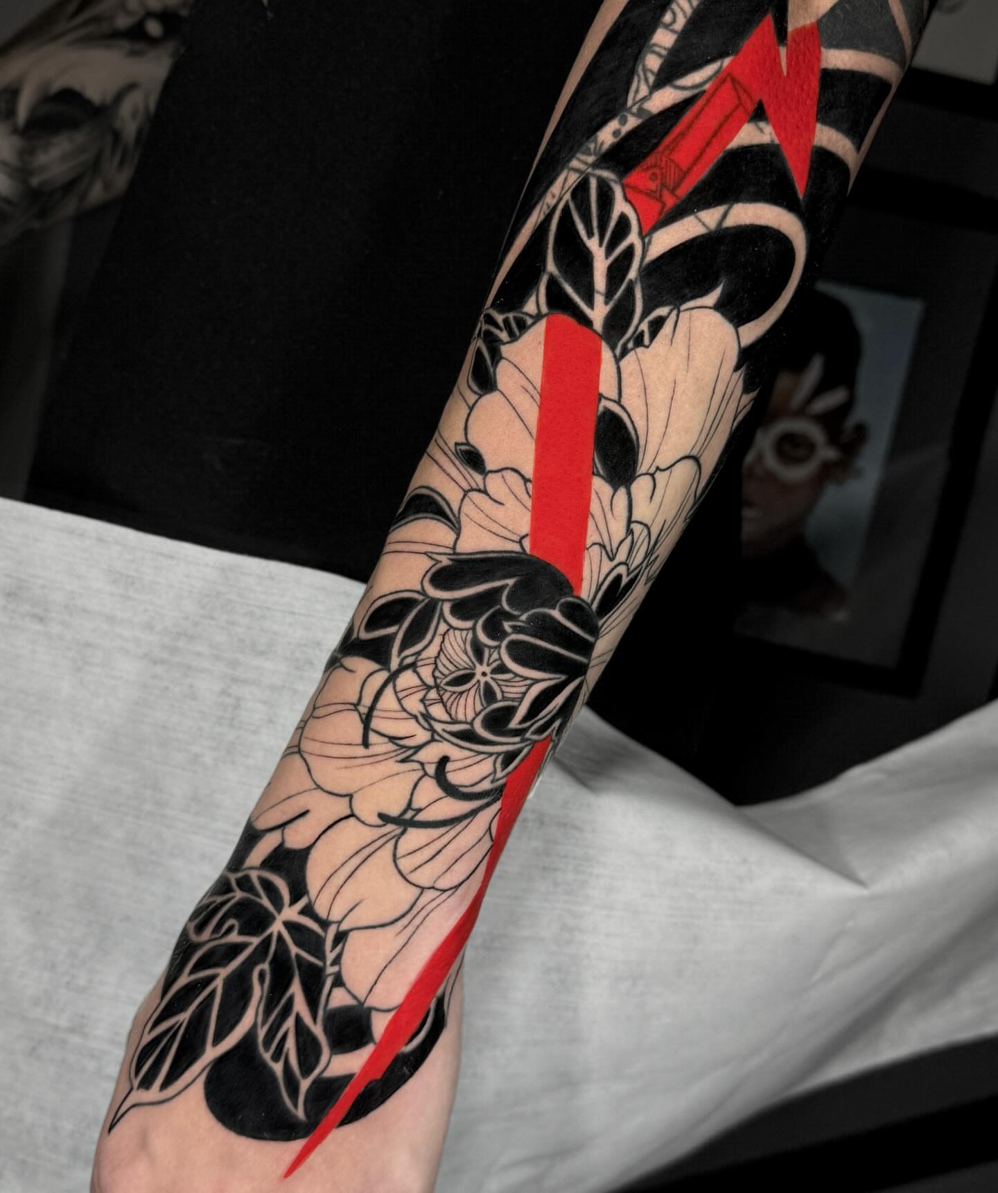 Floral design black and grey tattoo on the forearm by Stiven Gomez