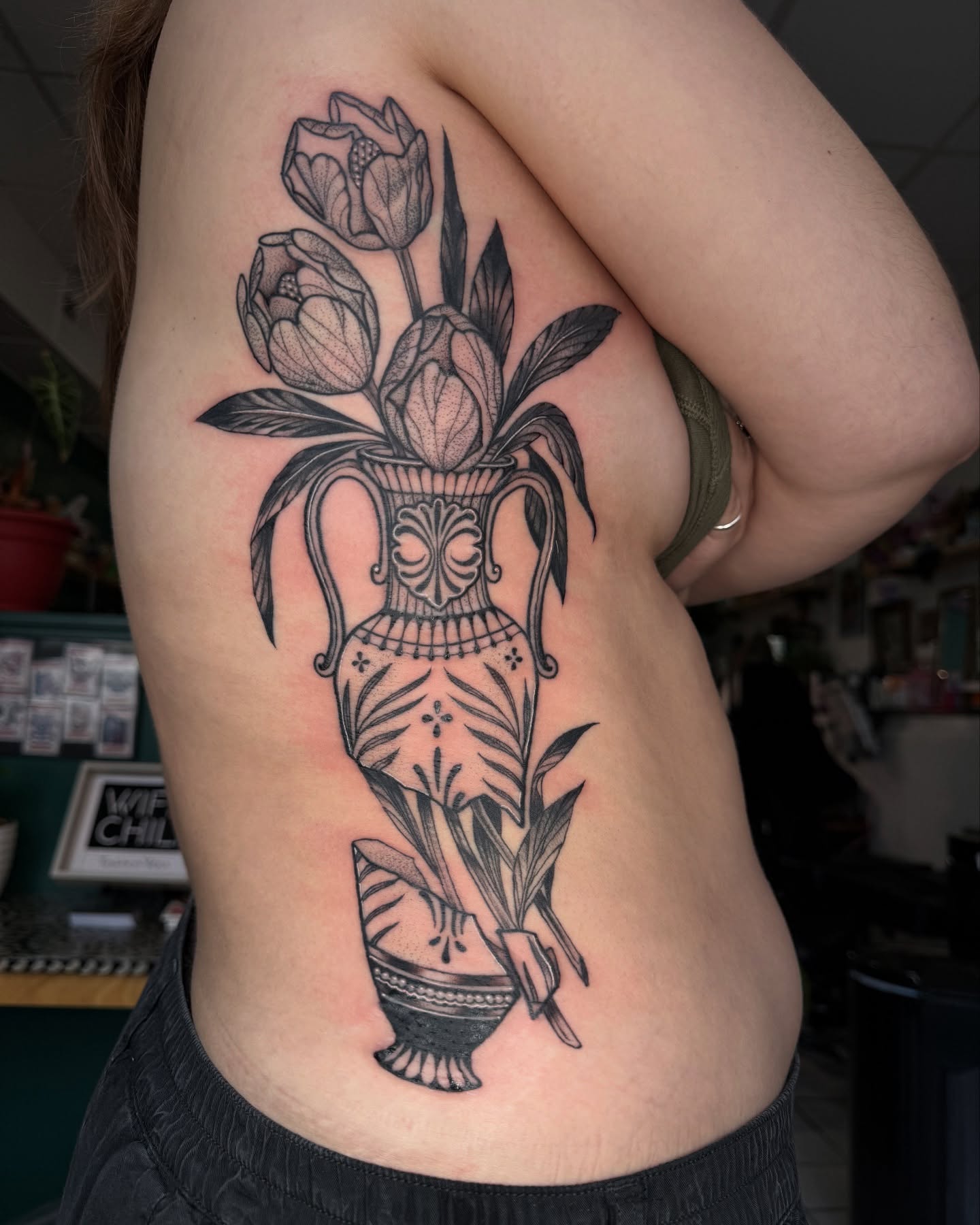 Vase with tulips black and grey tattoo on the shoulder by Tattoos.byDahlia, Austin, Texas