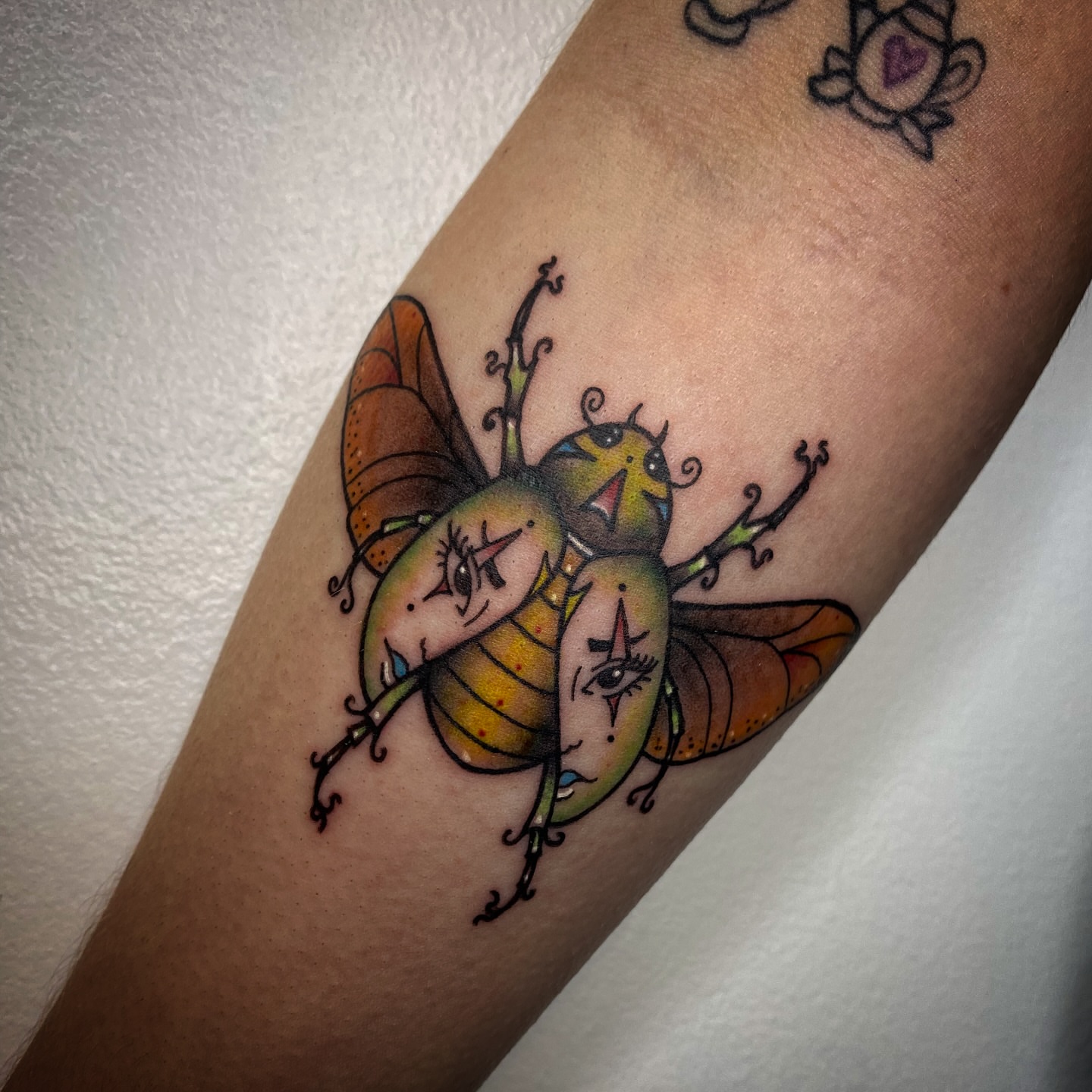 Insect couple new school tattoo on the forearm by Eden H., Columbus, Ohio