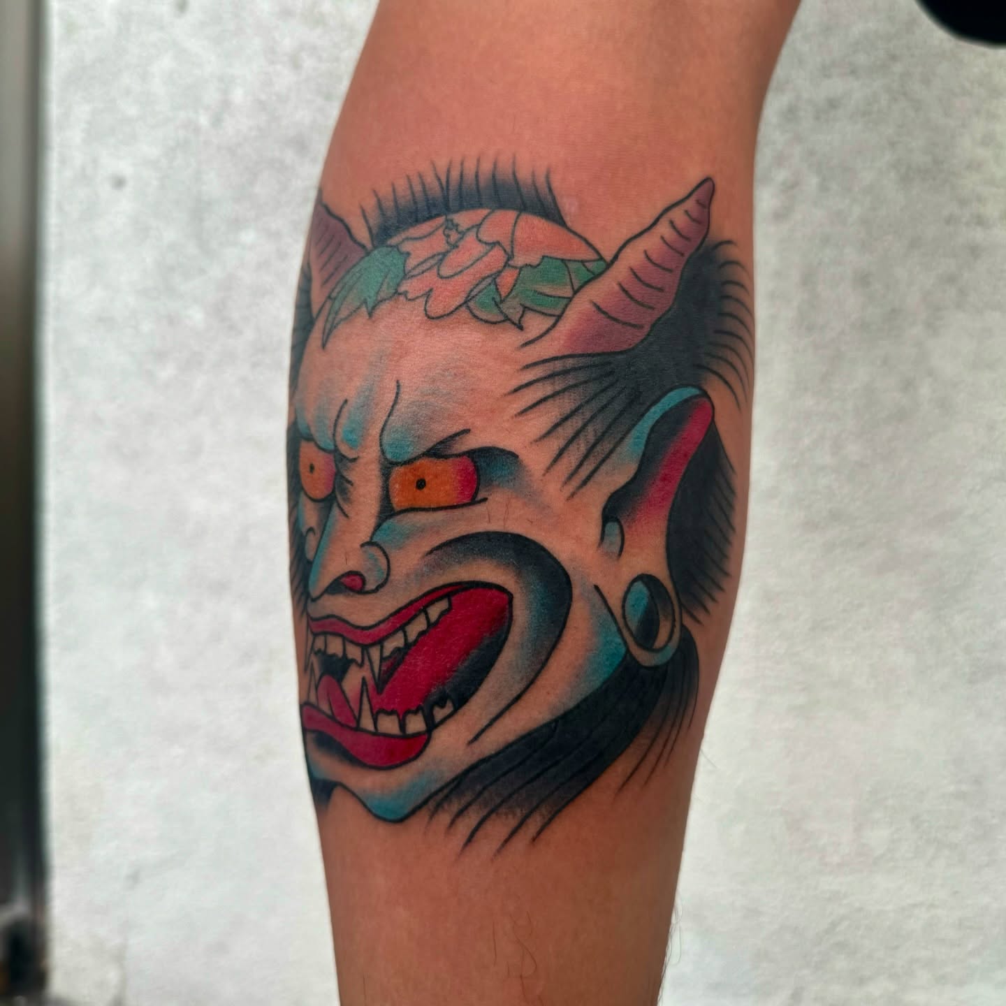 Demon face American traditional tattoo on the forearm by Drew🕸️, Phoenix, Arizona