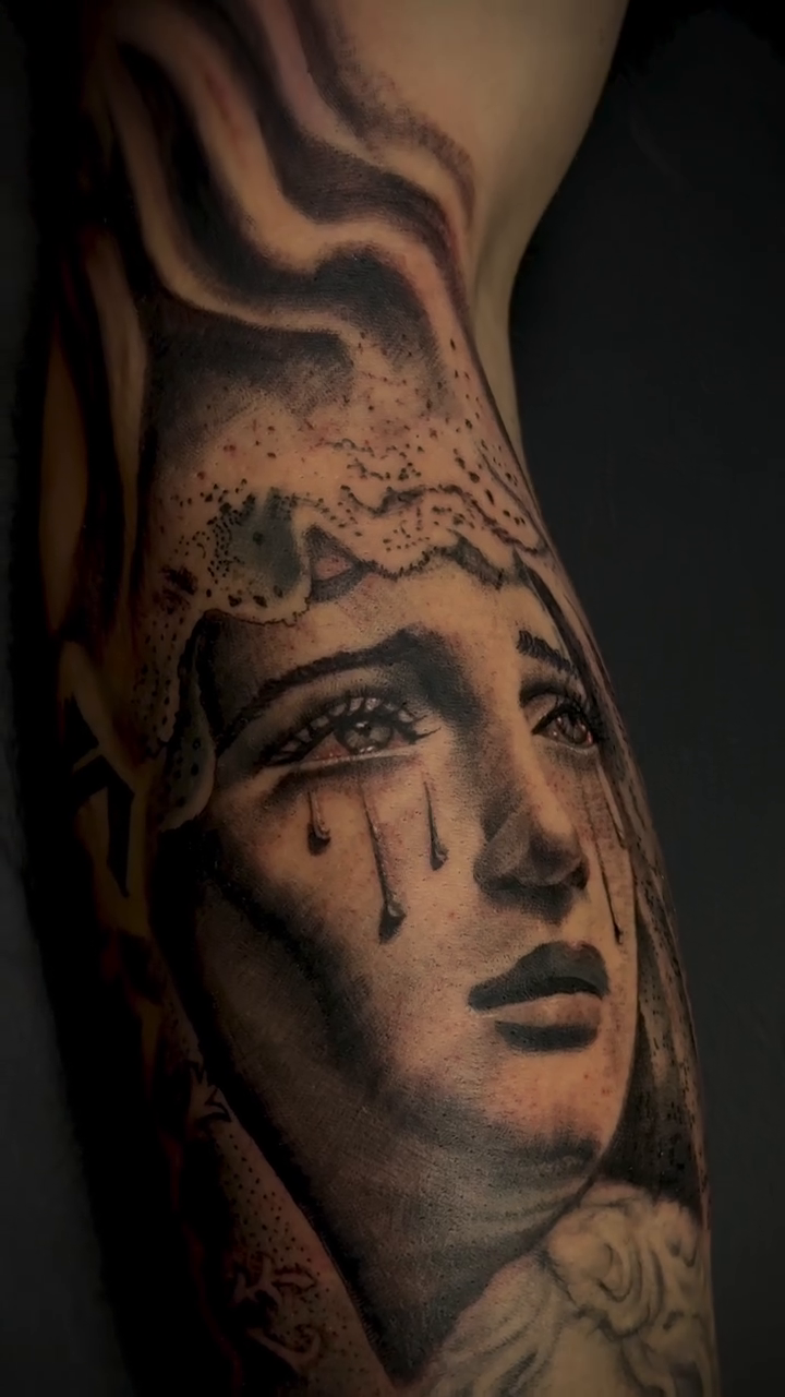 Weeping woman and cherubs realism tattoo by Henry Fuentes