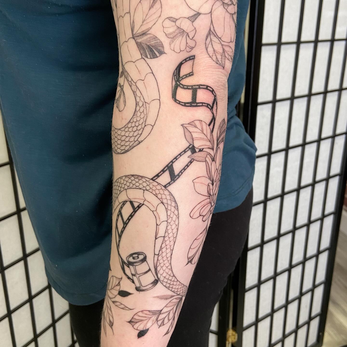 Snake and floral black and grey tattoo on the forearm by Libbey June @ Snailberry Studios- NW OHIO