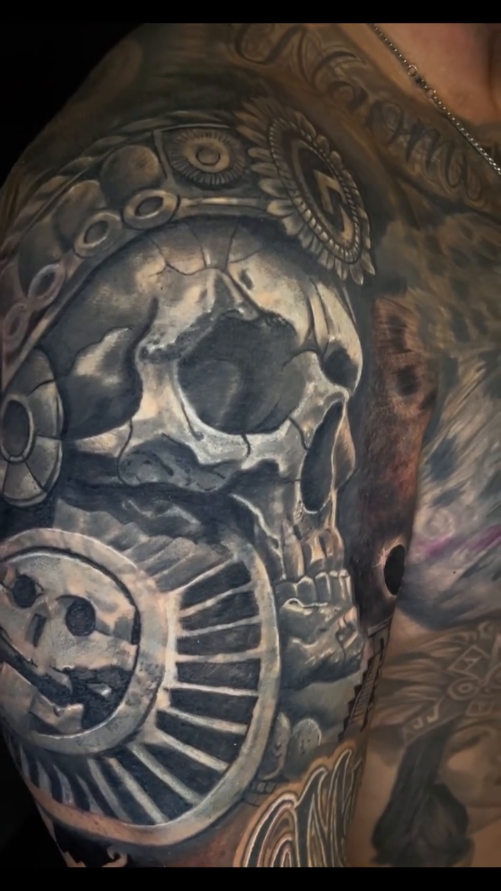 Skull with tribal headdress realism tattoo by Vic