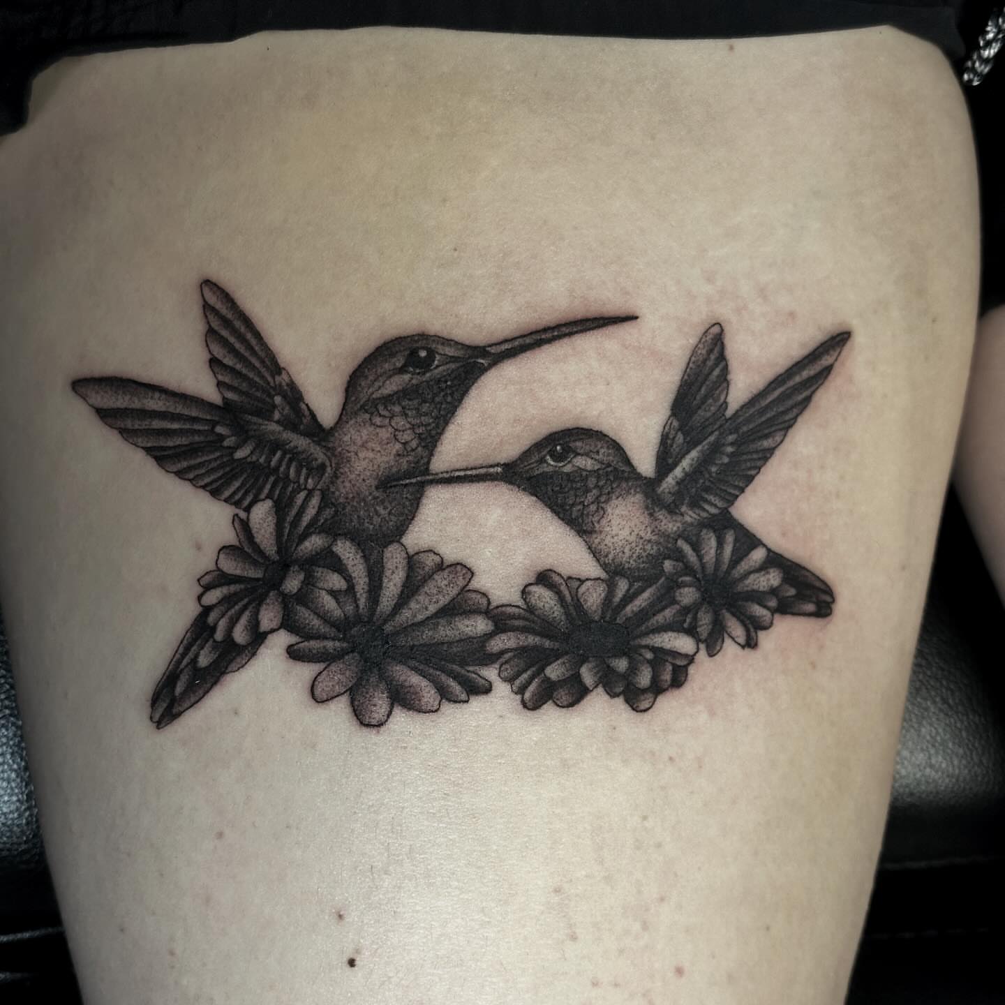Hummingbirds and flowers dotwork tattoo on the thigh by Elizabeth Tabler