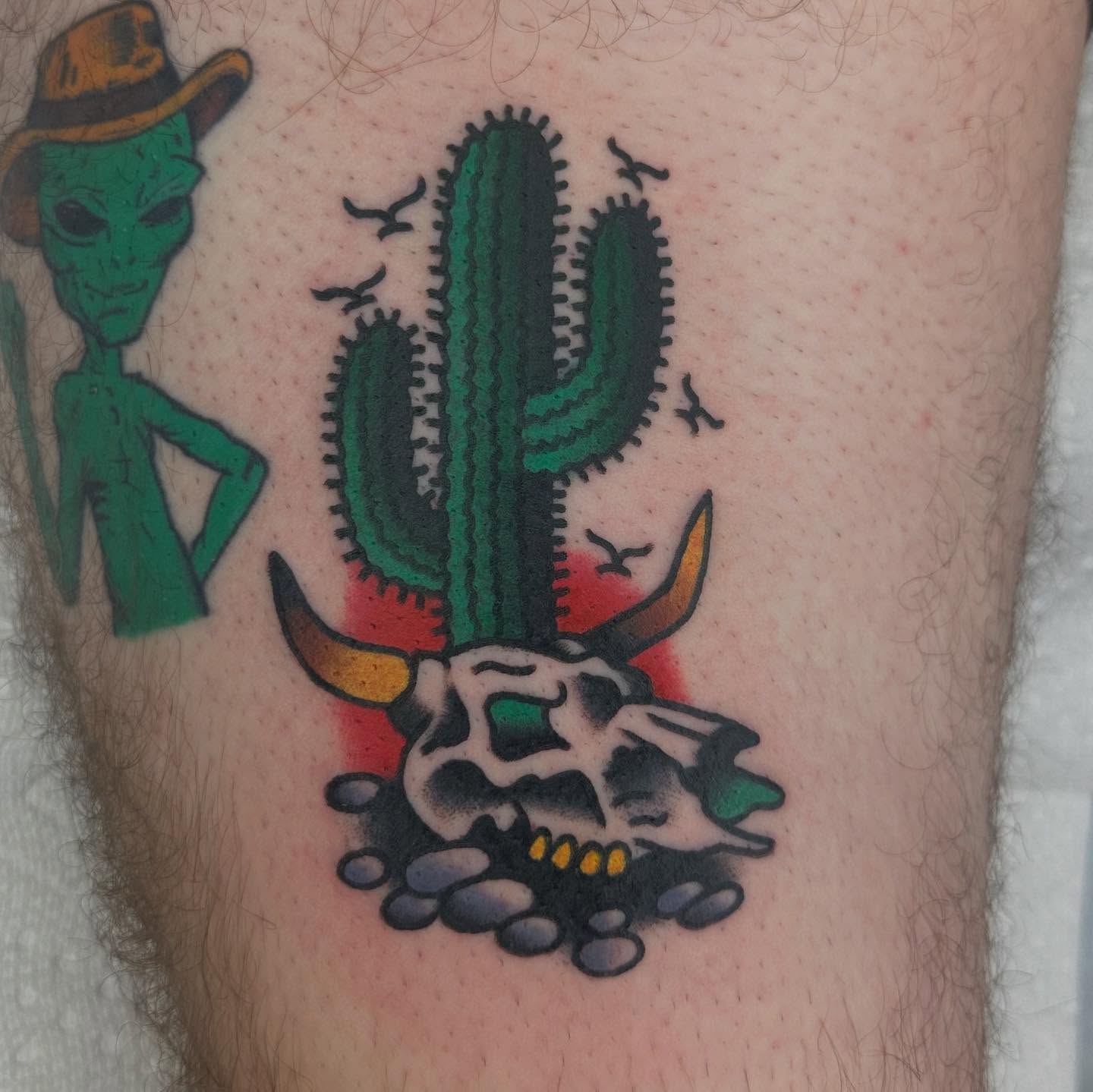 Alien, cactus, bull skull American traditional tattoo on the thigh by Keon Ostby, Tempe, Arizona