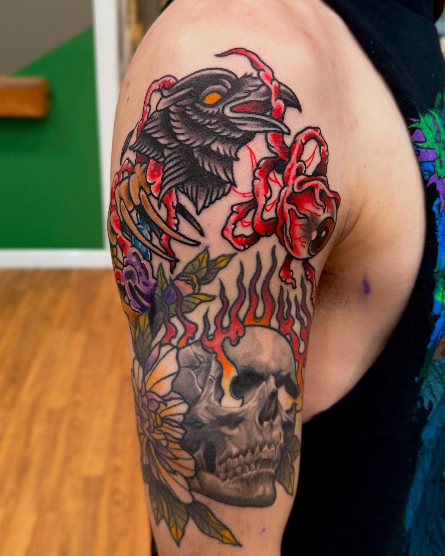 Crow and skull American traditional tattoo on the shoulder by Sam Babcock