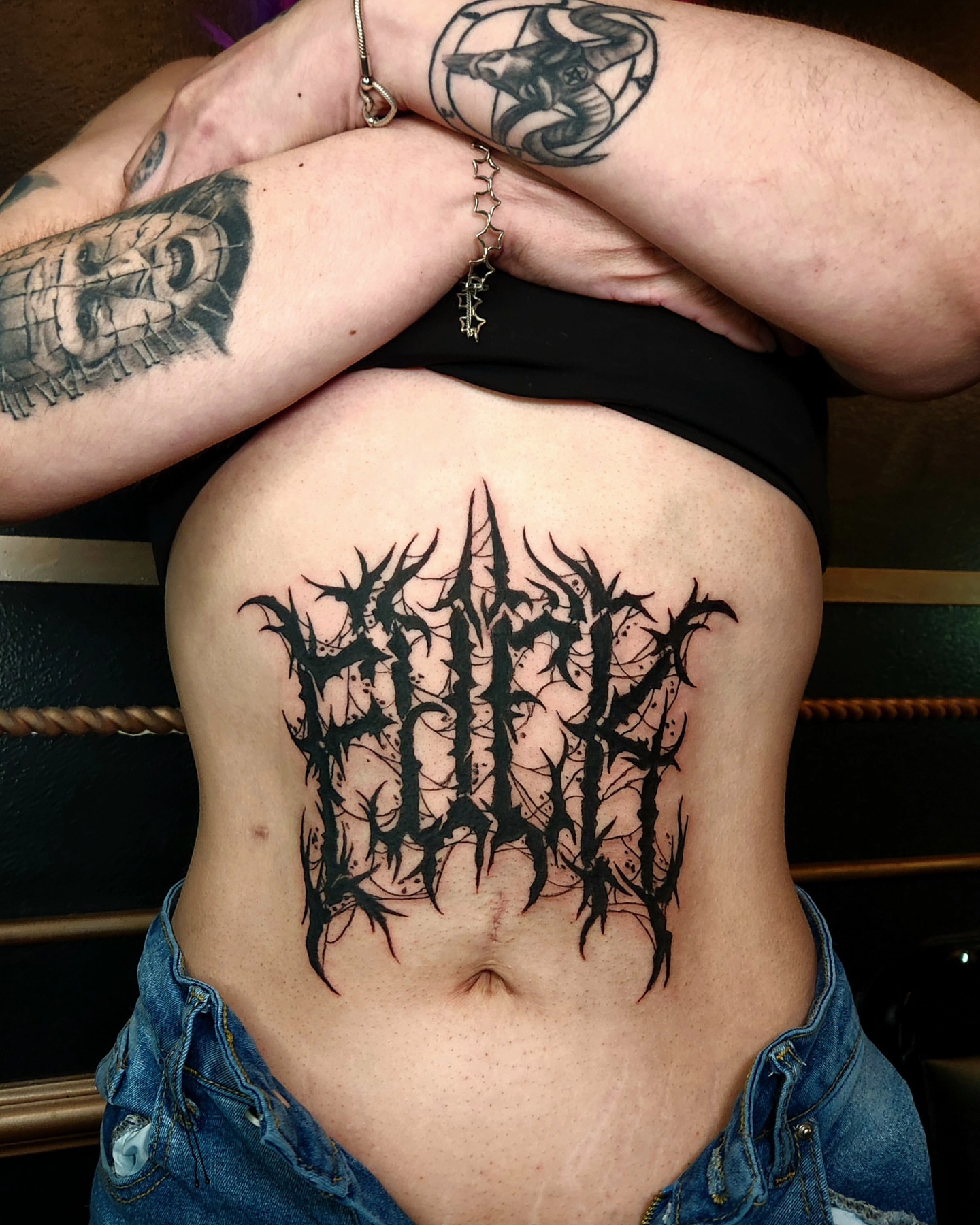 Gothic script black and grey tattoo on the ribs by Perry
