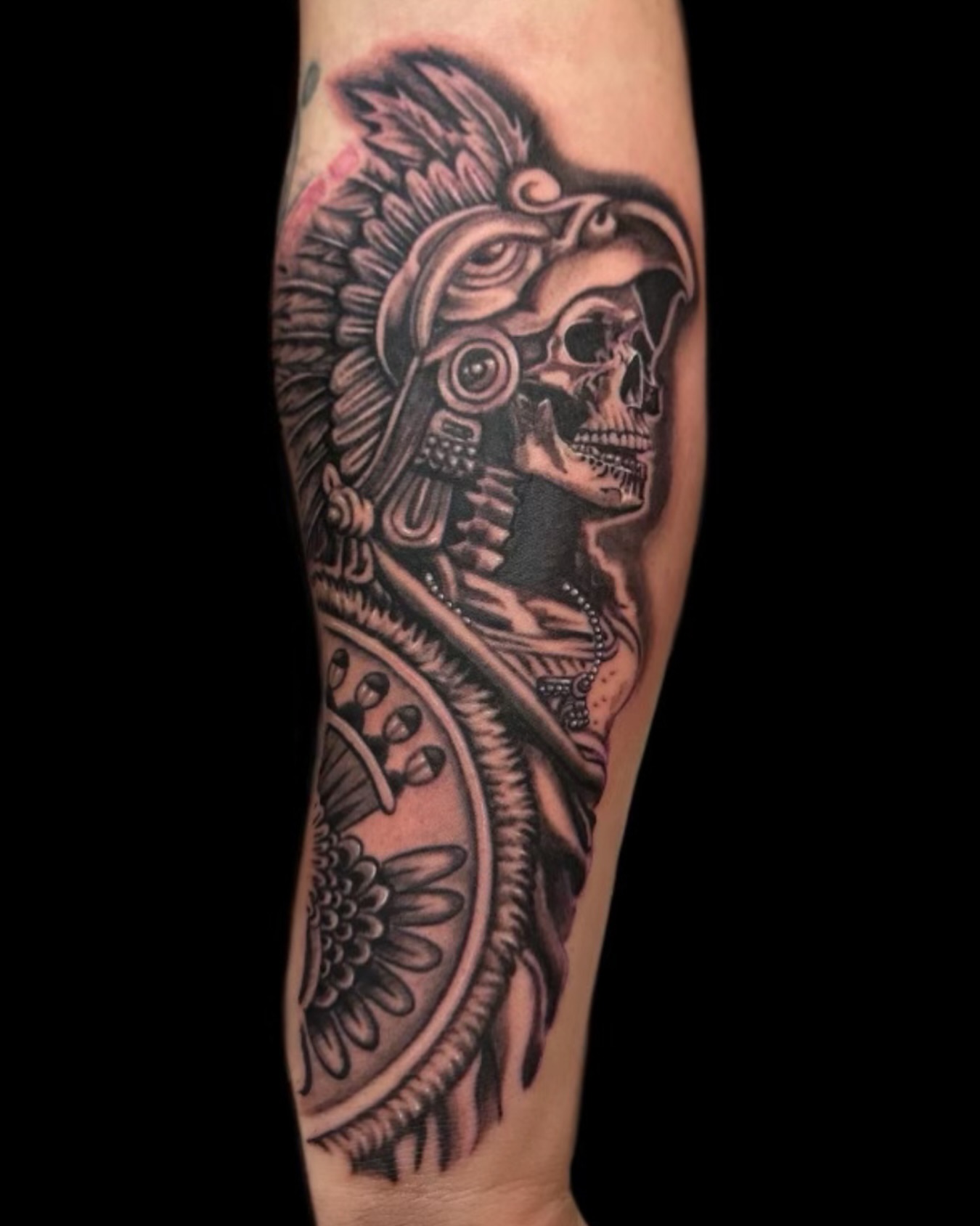 Skull wearing headdress American traditional tattoo on the forearm by las vegas tattoo artist