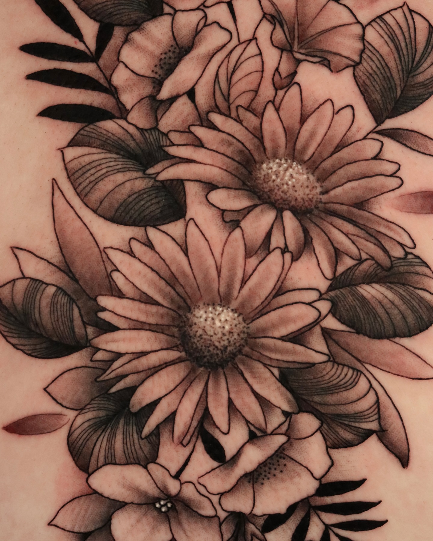 Daisies black and grey tattoo by Jeff Reindel
