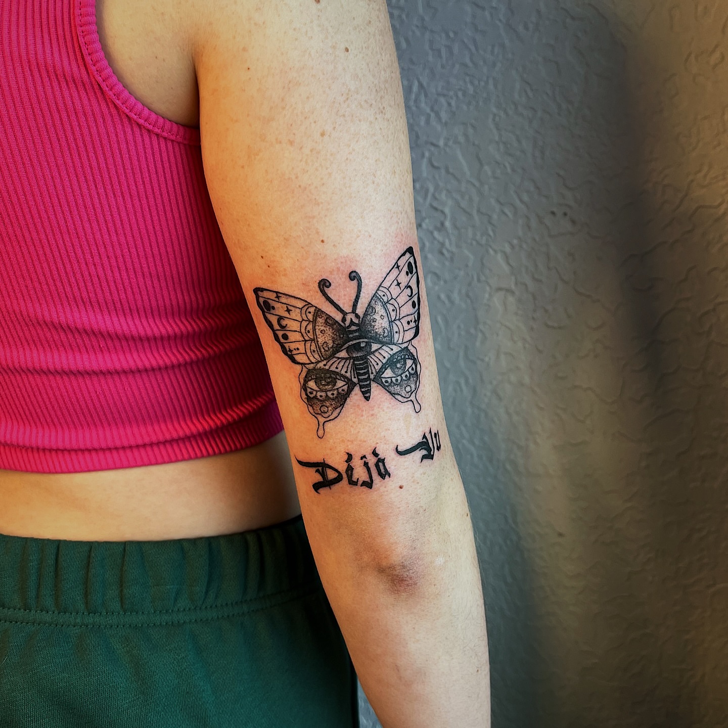 Butterfly black and grey tattoo on the forearm by Nikki Ward