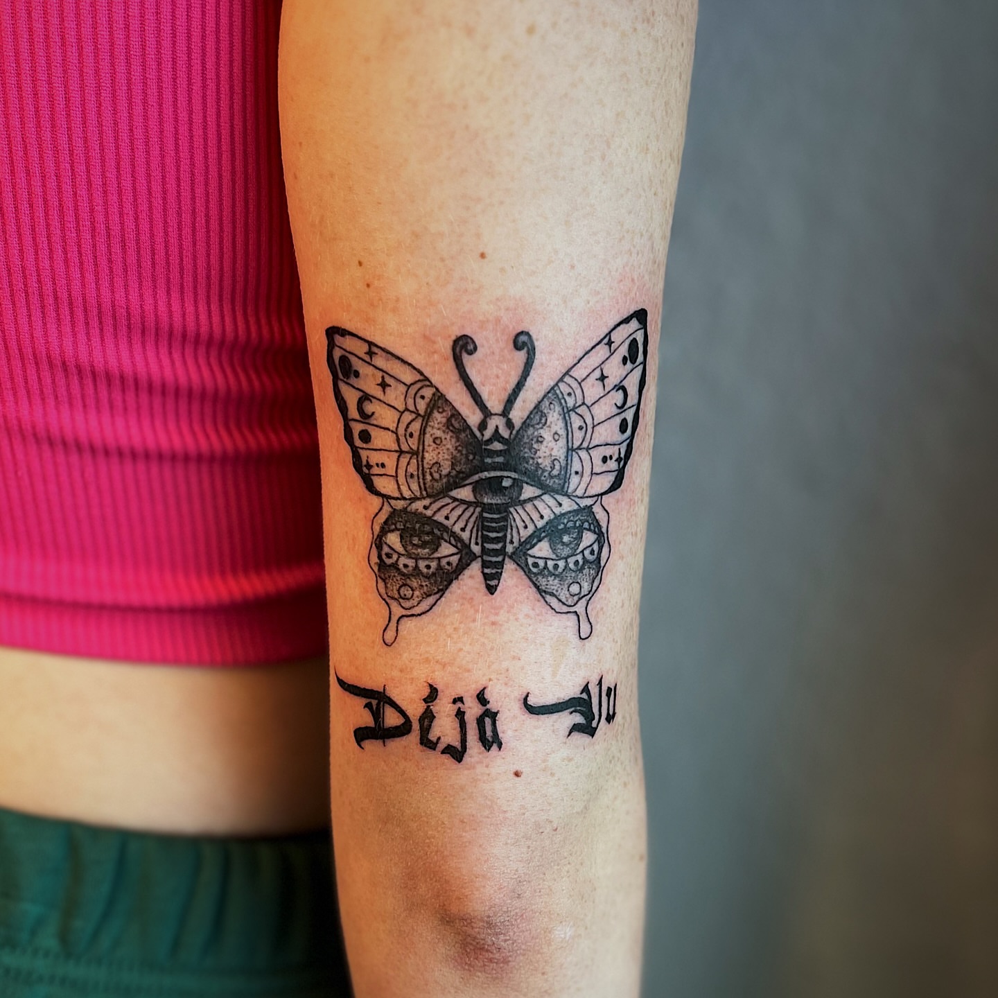 Butterfly with eyes dotwork tattoo on the forearm by Nikki Ward
