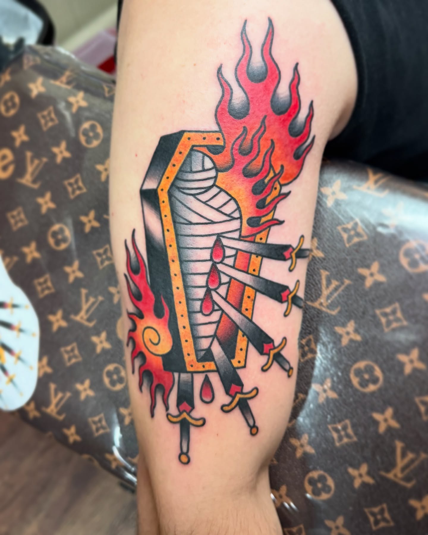Mummy with swords American traditional tattoo on the forearm by Casket
