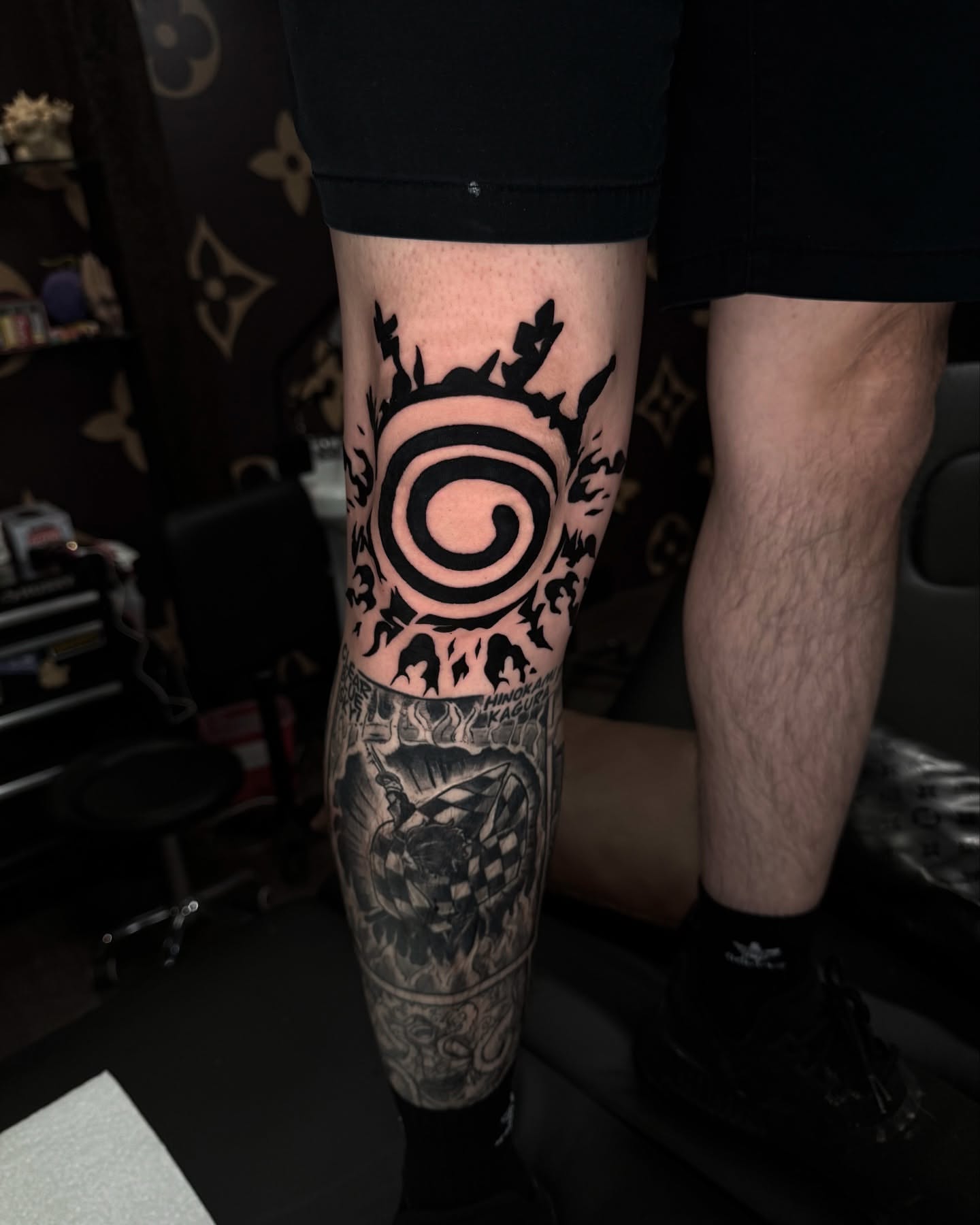Ninja village symbol black and grey tattoo on the calf by Anthony D. Rustik