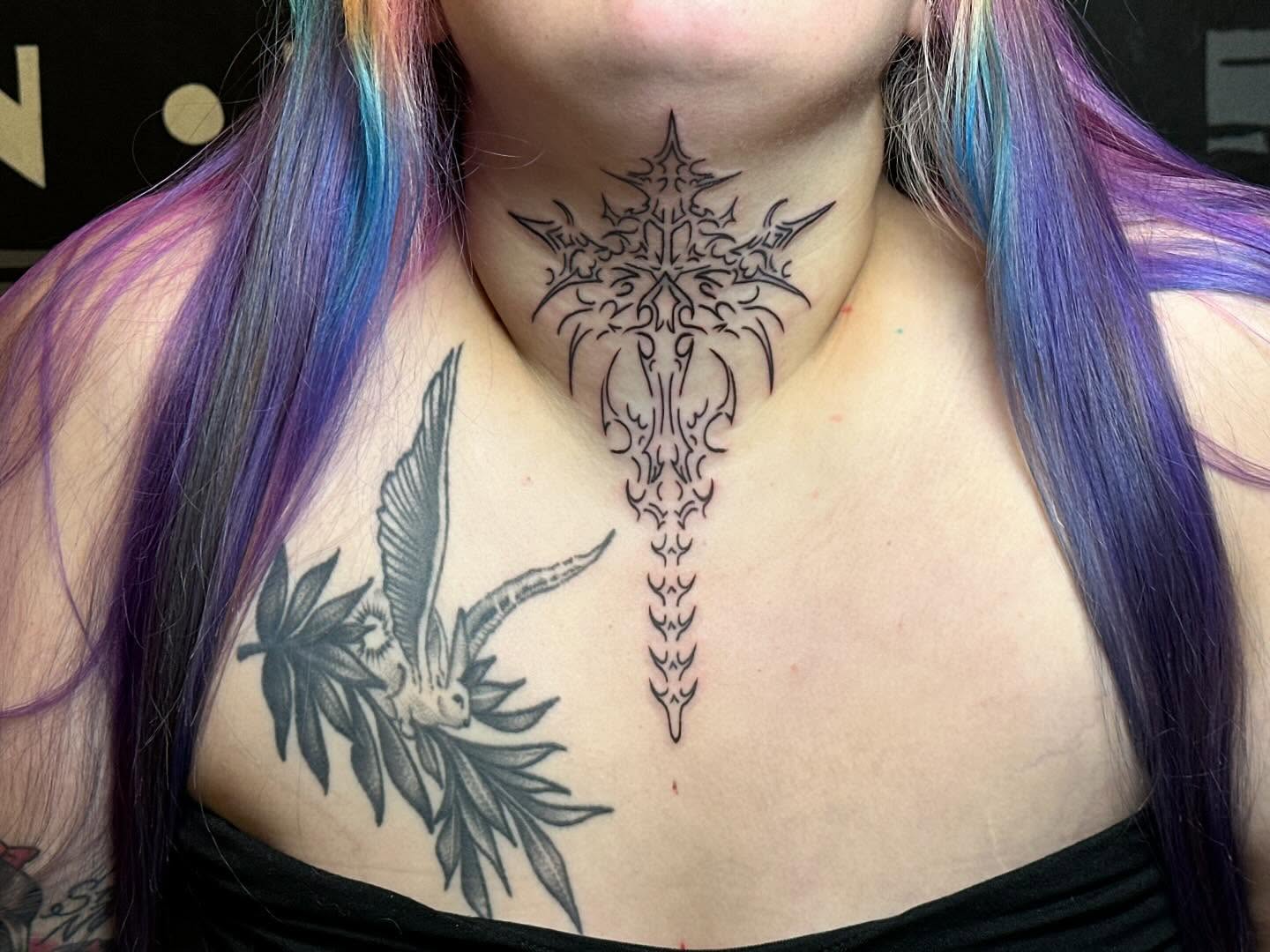Bird and cannabis leaf tribal tattoo on the chest by Kerri Colello Sittenauer