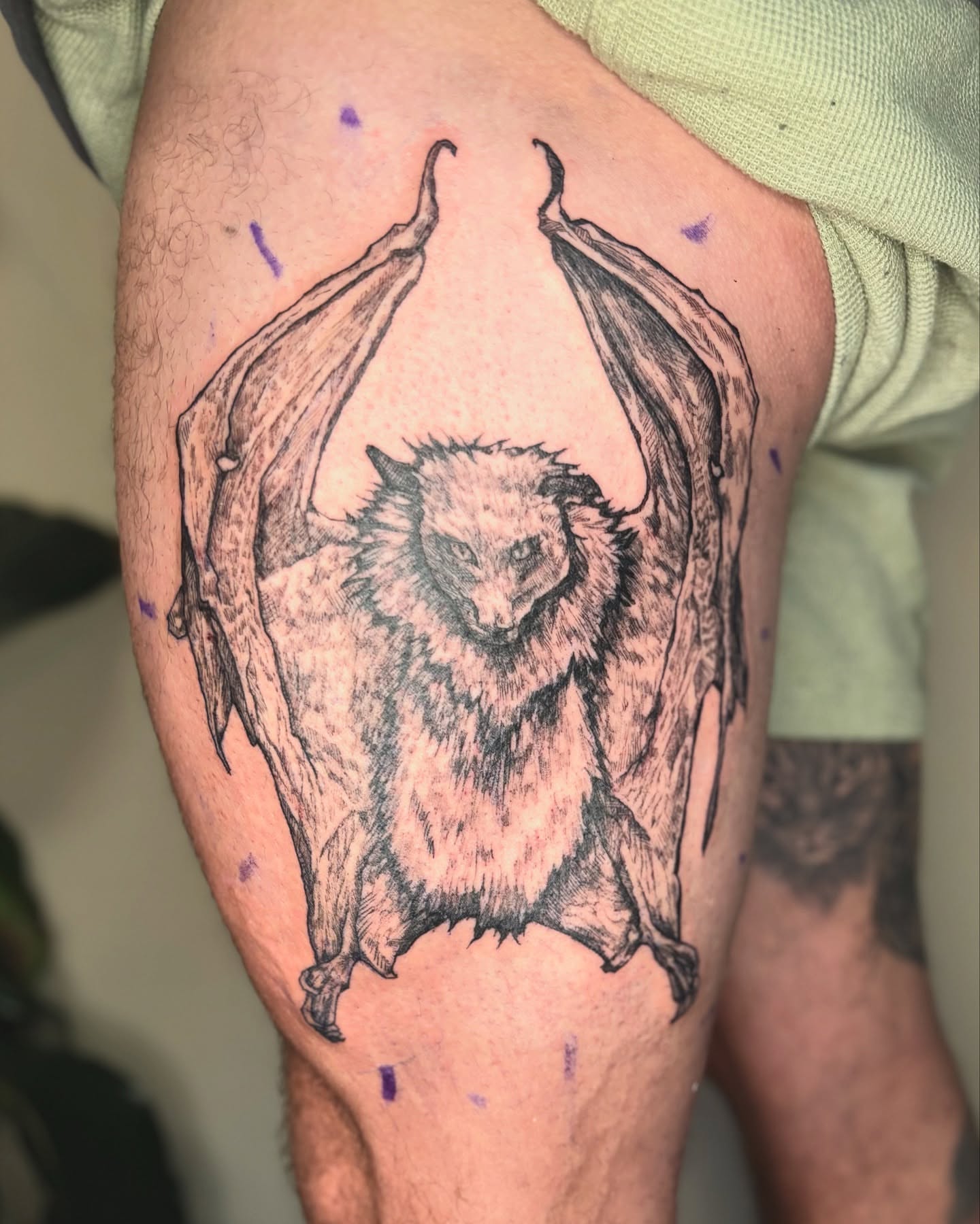 Bat black and grey tattoo on the thigh by Wren Cavanaugh Tattoos, Seattle, Washington