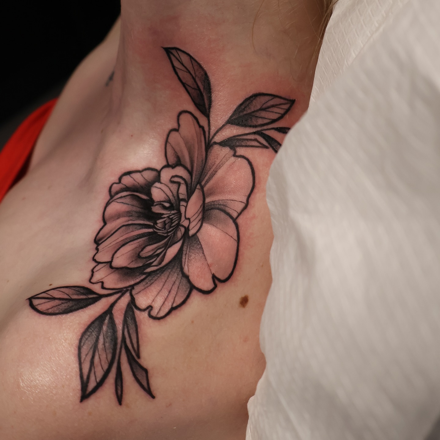Flower black and grey tattoo on the chest by mssinderella