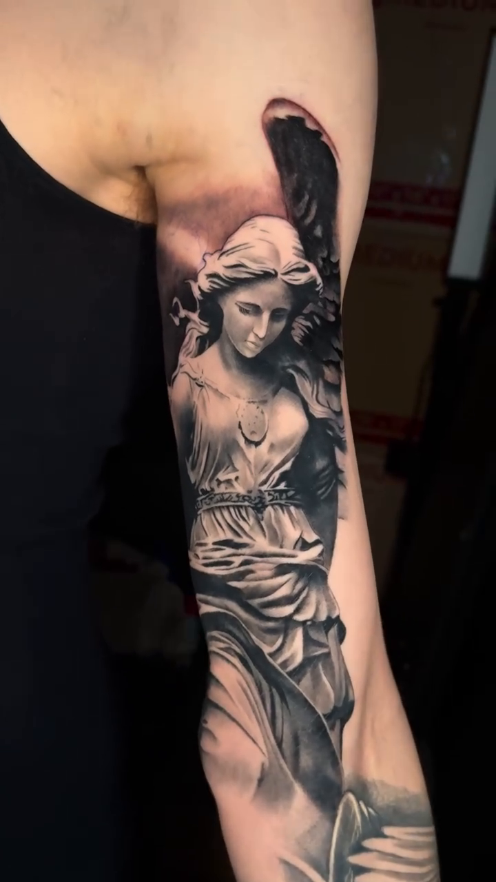 Angel statue realism tattoo by Kaleb Trujillo