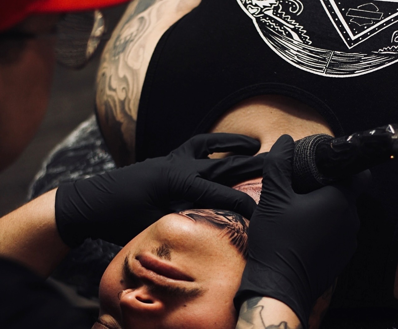 Man's face American traditional tattoo on the chest by Jesse Temores