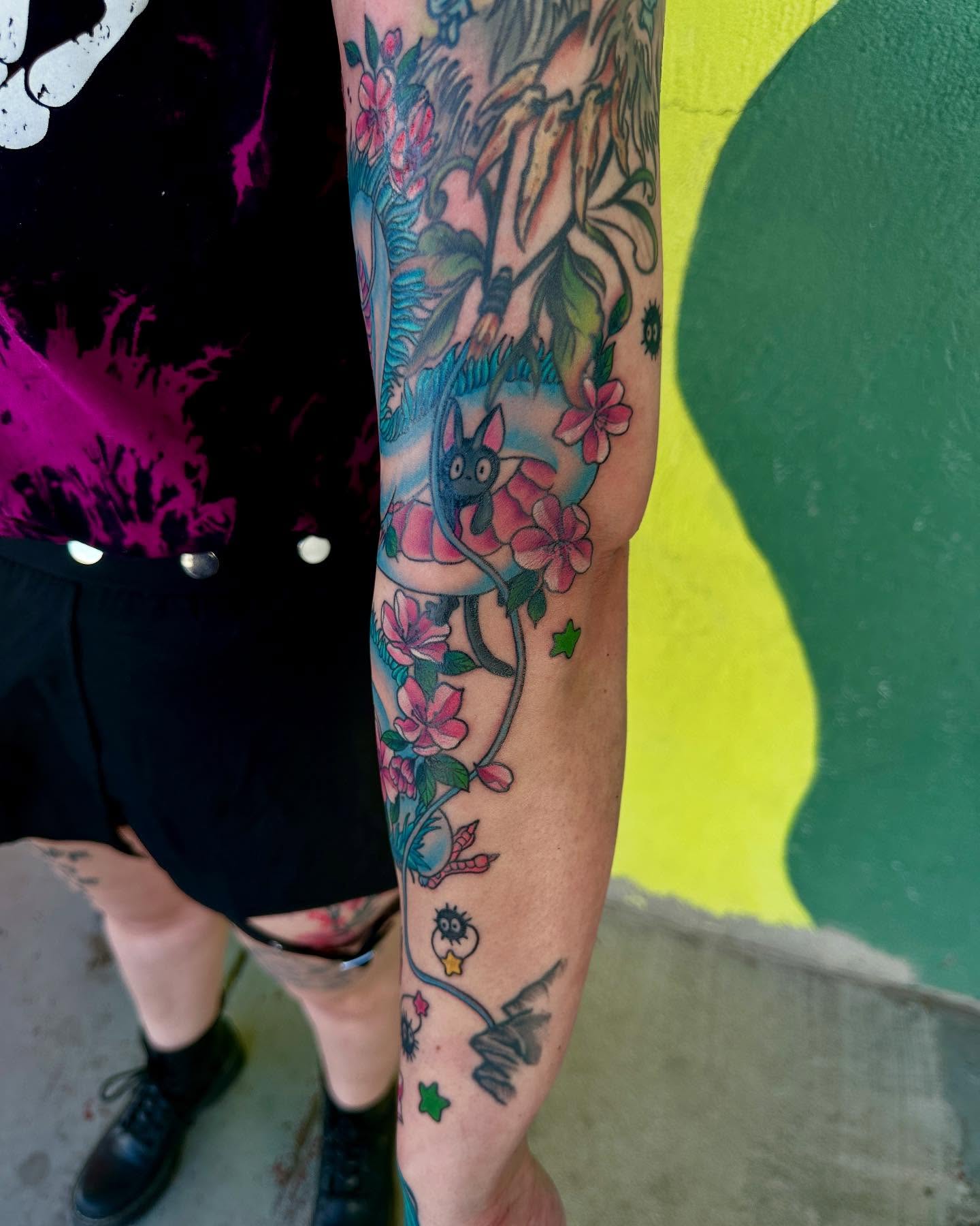 Cat and cherry blossoms new school tattoo on the forearm by Holle Hellfire