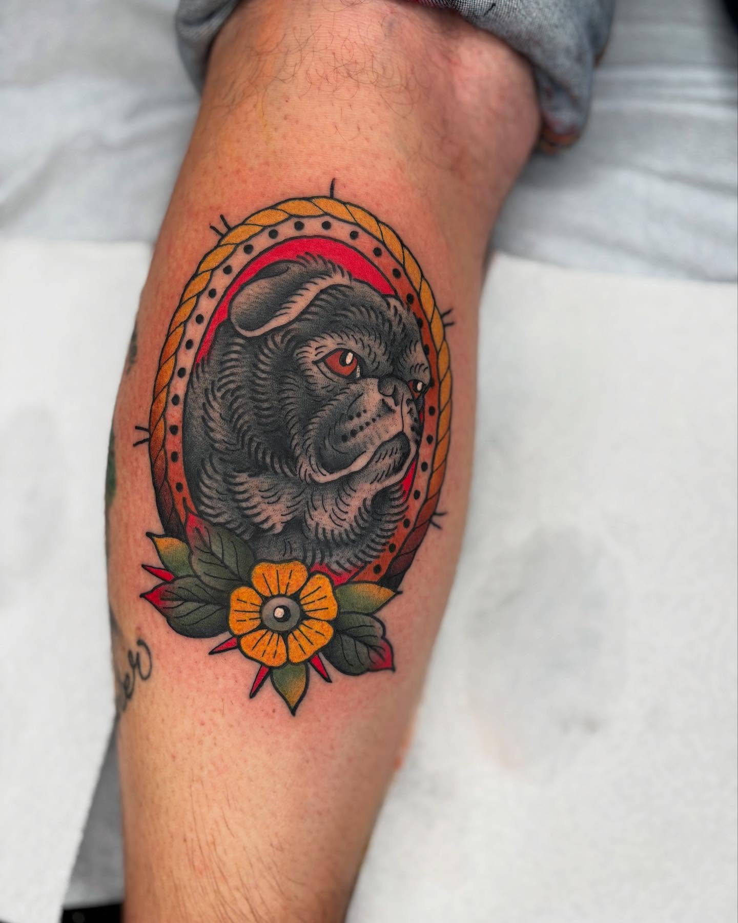 Dog head American traditional tattoo on the forearm by Cody Collins