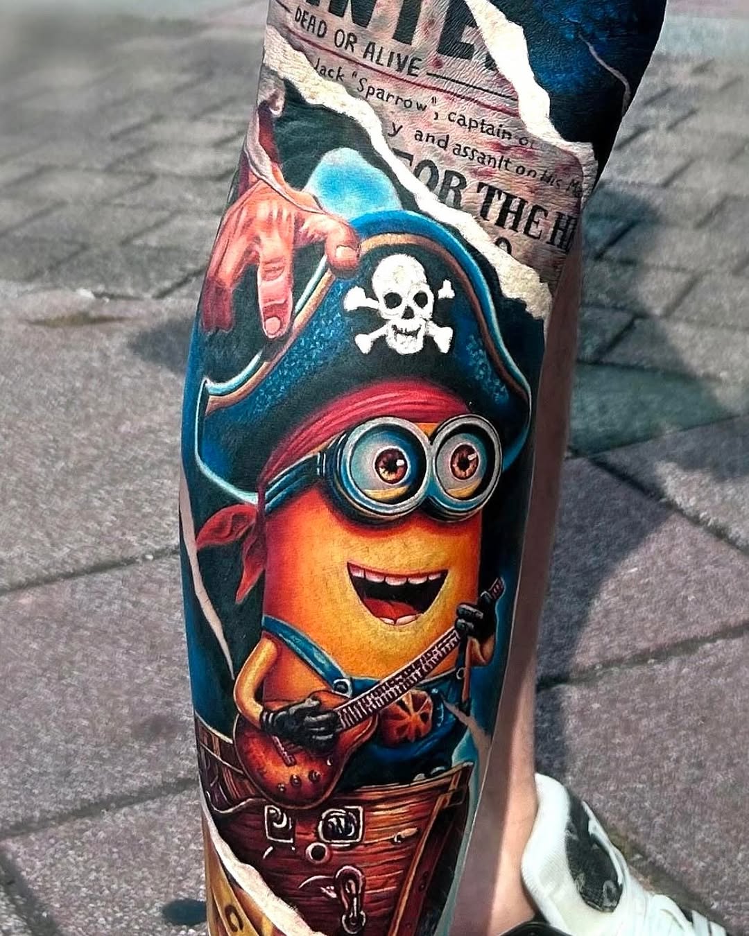 Minion pirate playing guitar new school tattoo on the forearm by Bình Nguyễn
