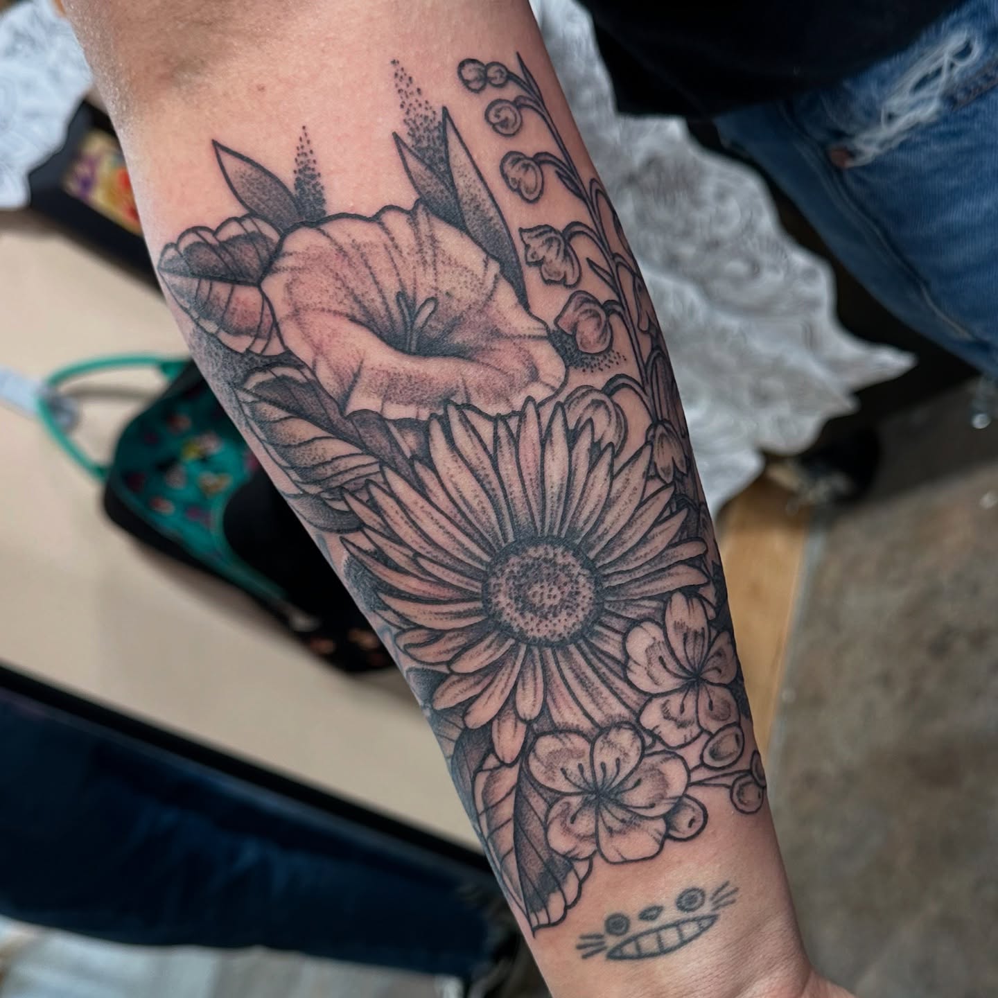 Flower bouquet dotwork tattoo on the forearm by Emily K Lingg