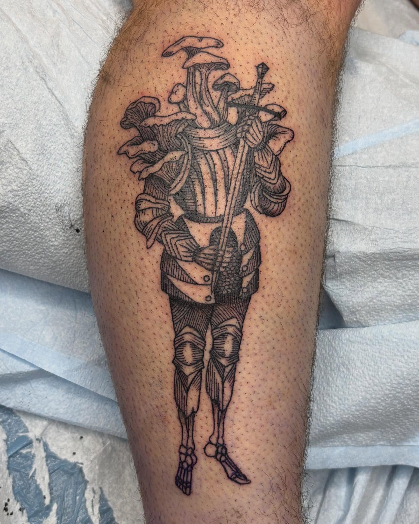 Mushroom warrior black and grey tattoo on the leg by Jamie Yuu, Minneapolis, Minnesota