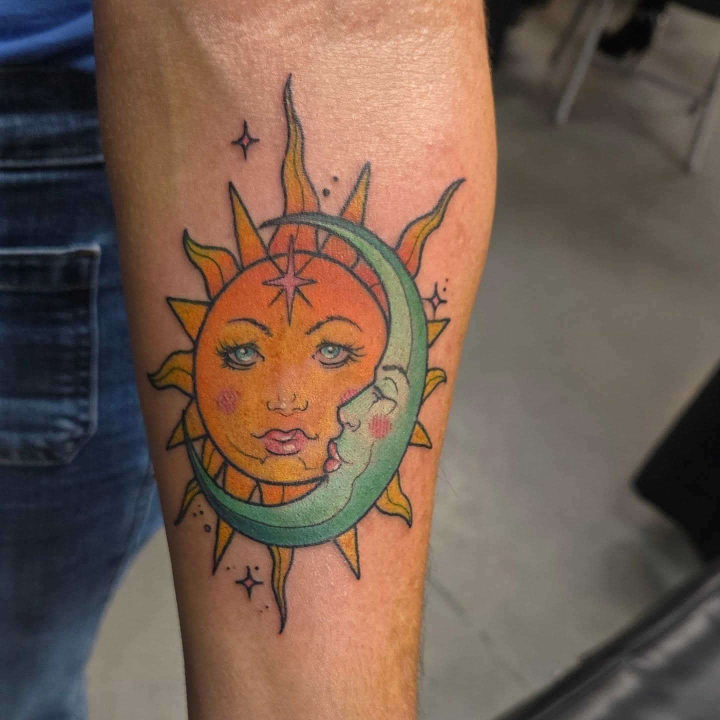 Sun and moon American traditional tattoo on the forearm by Jamie Clinton