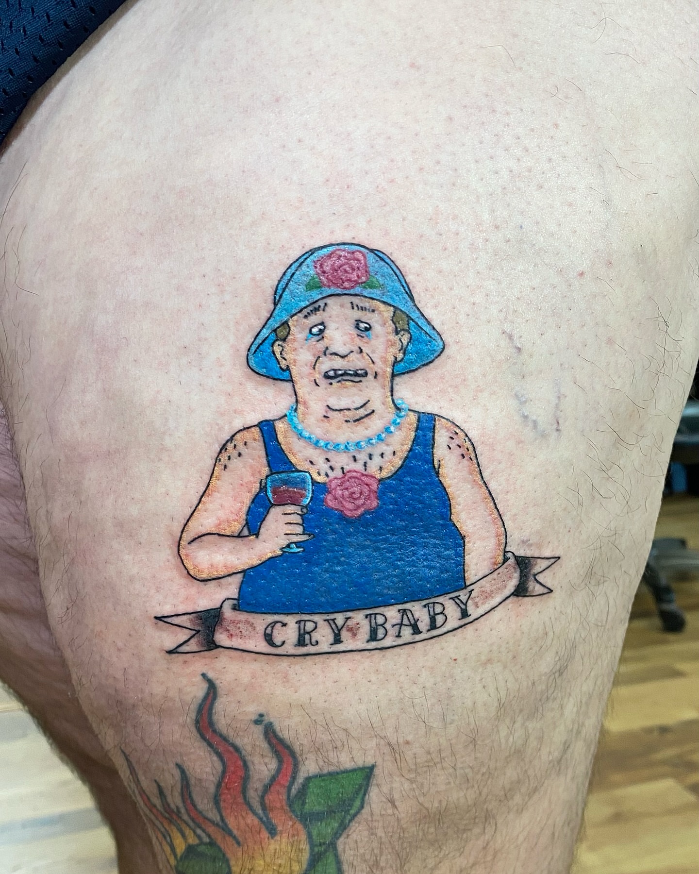 Elderly woman American traditional tattoo on the thigh by Destinee DeFriece