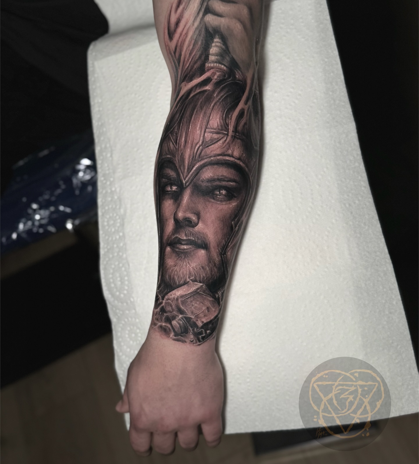 Man's face realism tattoo on the forearm by Justin (iam3) Leifeste