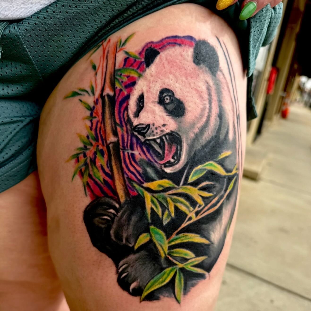 Panda realism tattoo on the thigh by Michael Latendresse