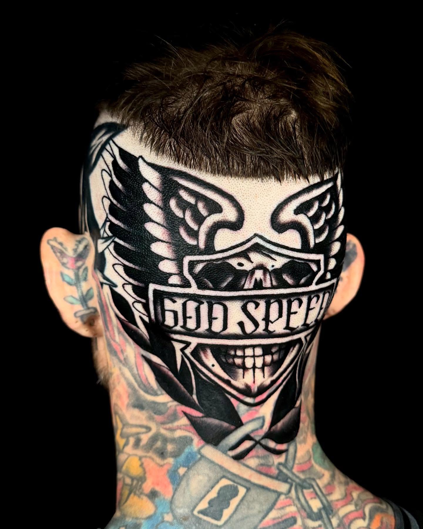 Smiling skull with wings American traditional tattoo on the head by Sweets, Nashville, Tennessee