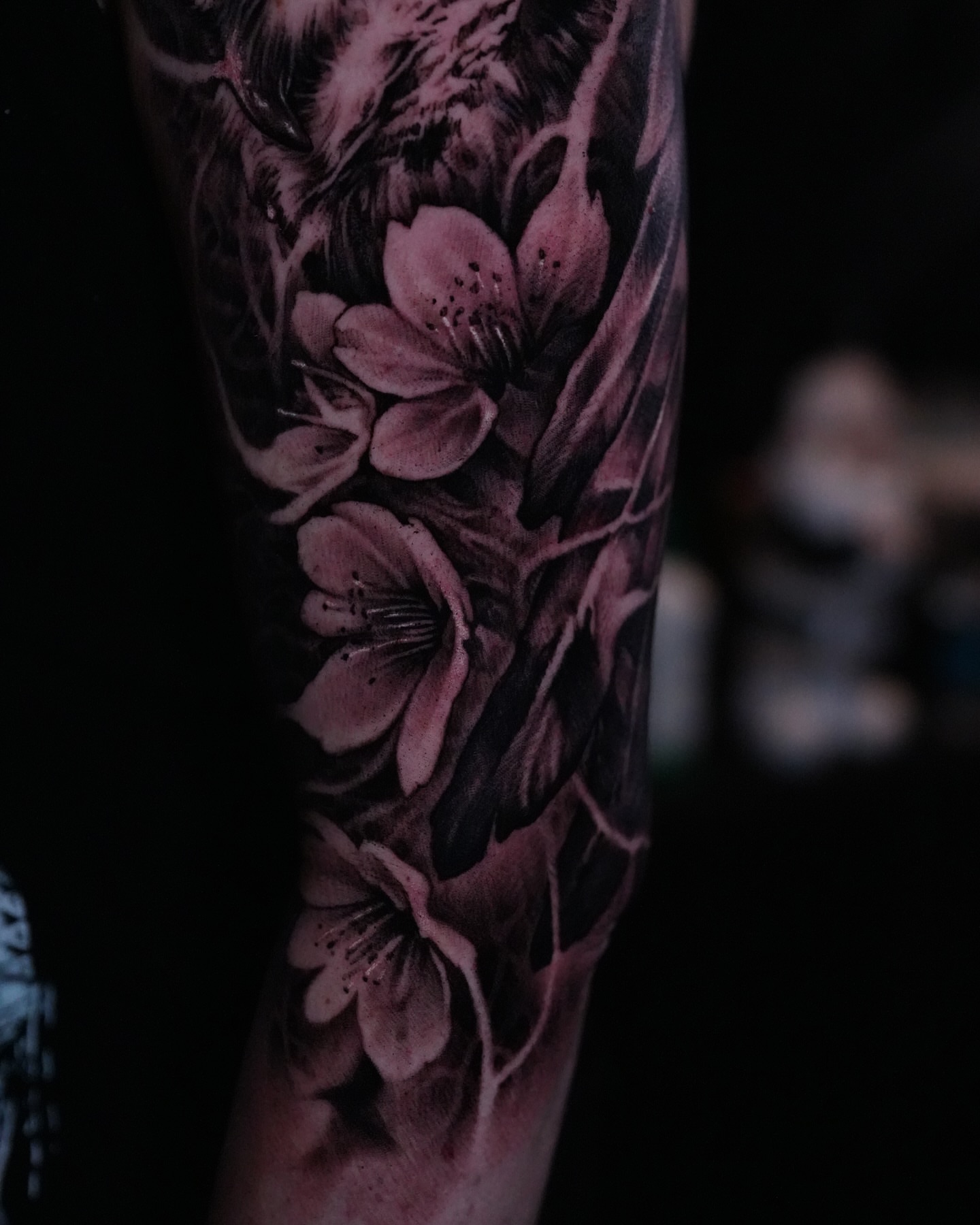 Cherry blossoms realism tattoo on the forearm by Nico Perez