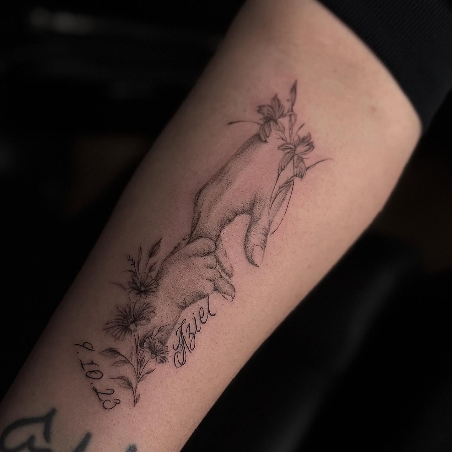 Mother and child hands realism tattoo on the forearm by Jocelyn