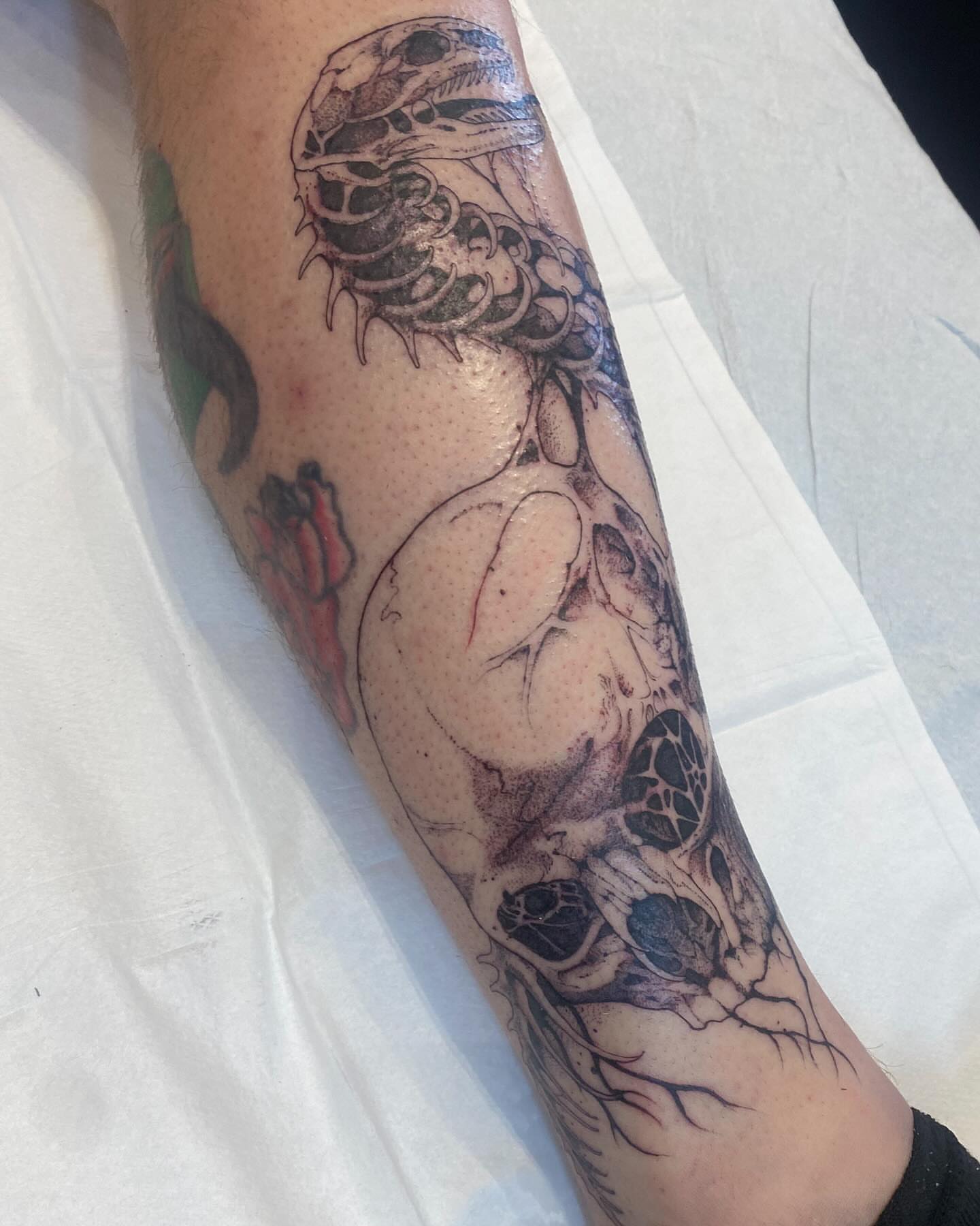 Abstract figure realism tattoo on the forearm by Becci Chelicerata