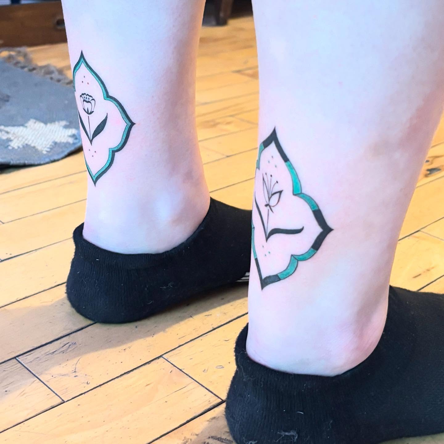Flower geometric tattoo on the foot by Reba Slate