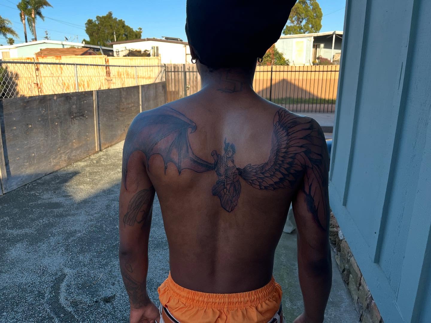 Winged angel neo-traditional tattoo on the back by Bris